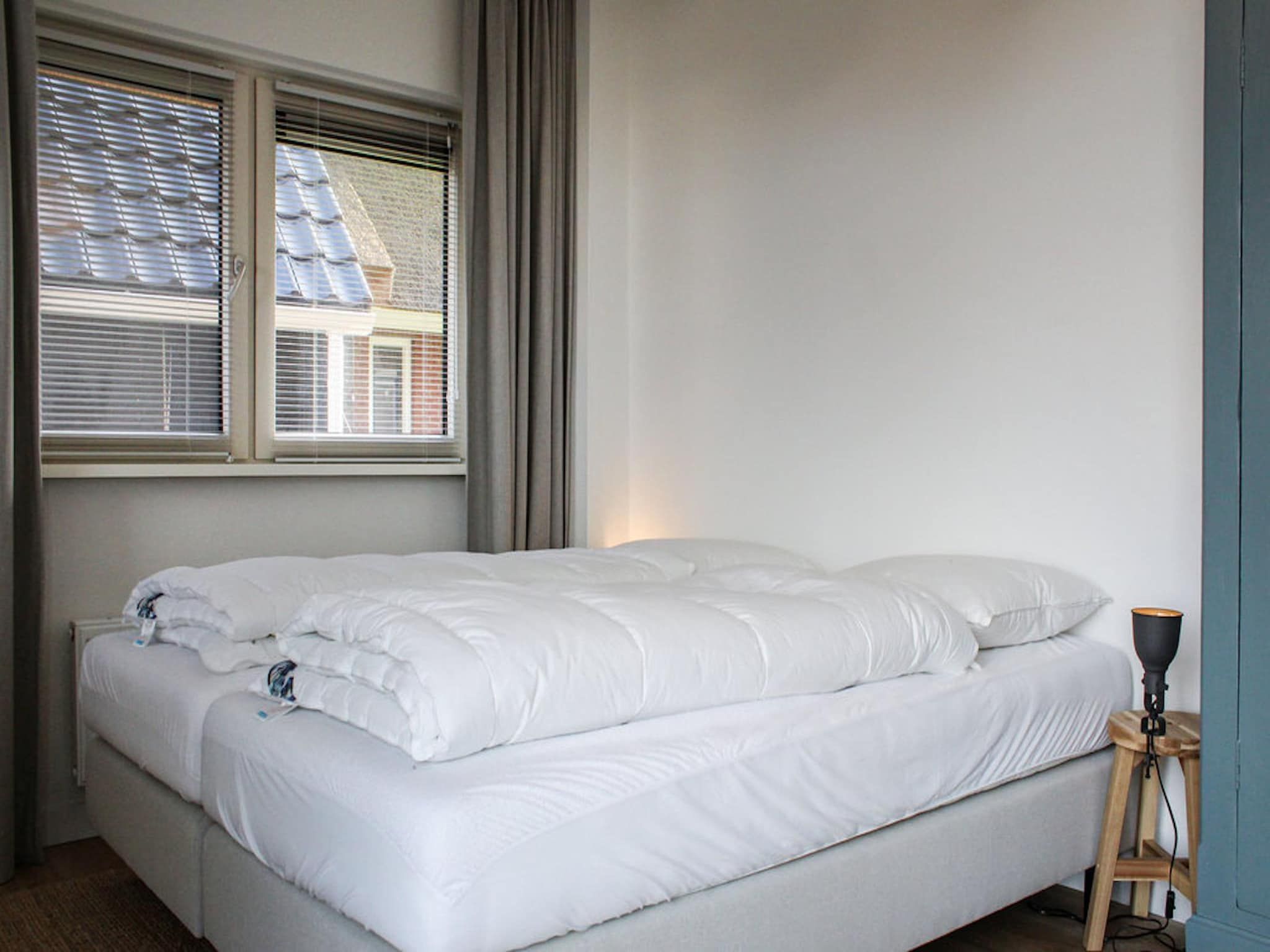 Een slaapkamer van Recreatiepark Idskenhuizen 8 in Idskenhuizen