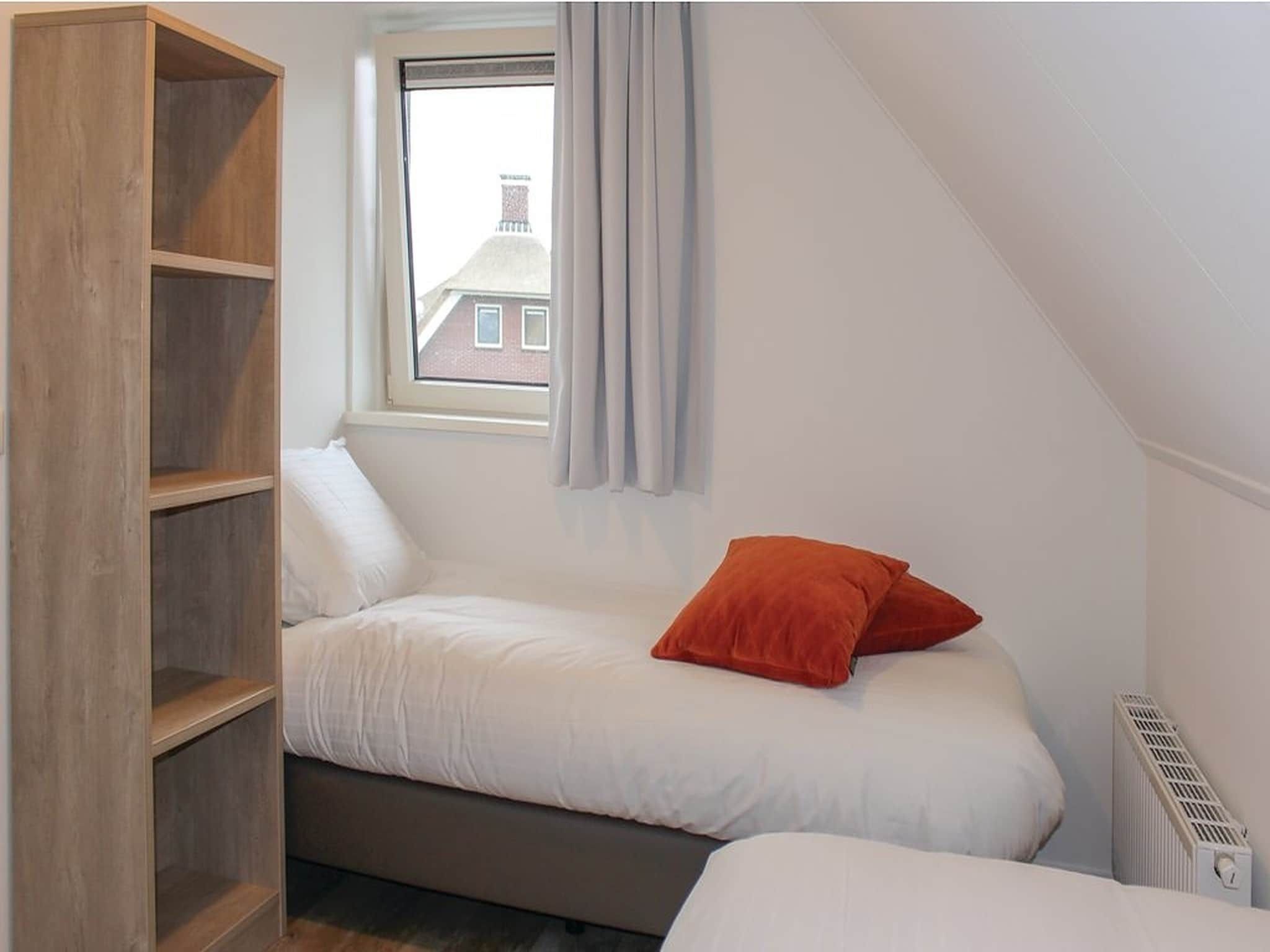 Een slaapkamer van Recreatiepark Idskenhuizen 10 in Idskenhuizen