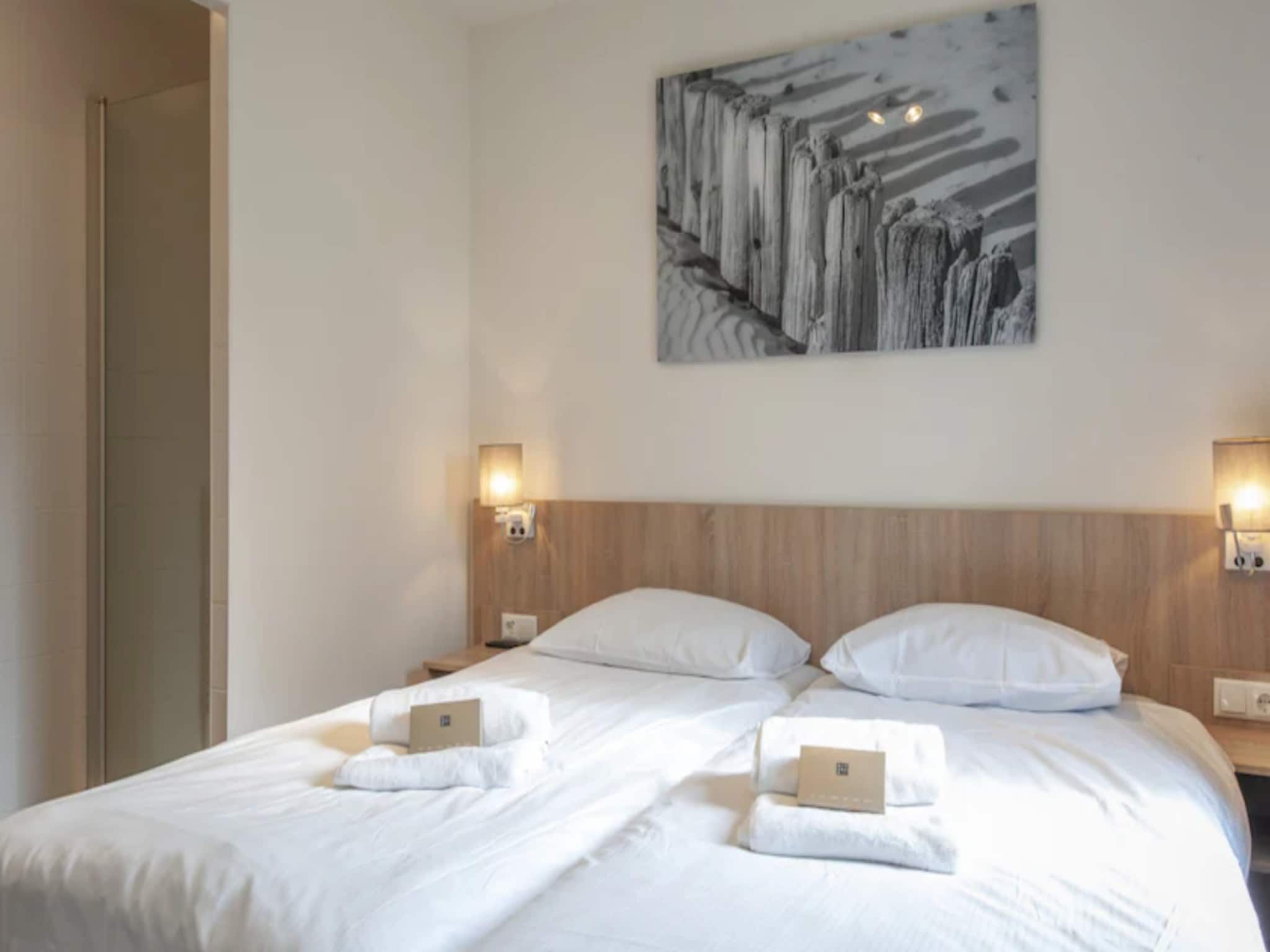 Een slaapkamer van Noordzee Résidence Cadzand-Bad 24 in Cadzand-Bad