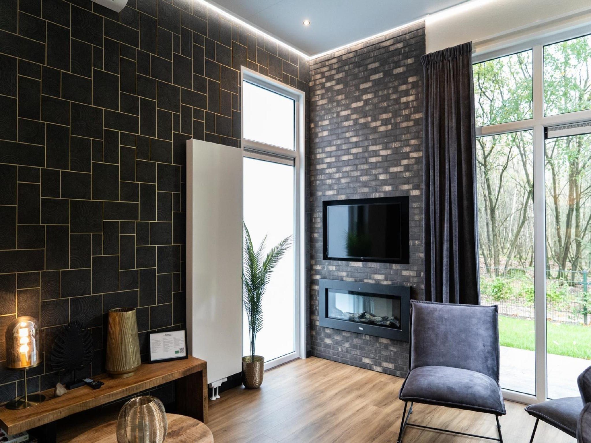 De woonkamer van Vakantiepark De Rimboe & De Woeste Hoogte 39 in Hoenderloo