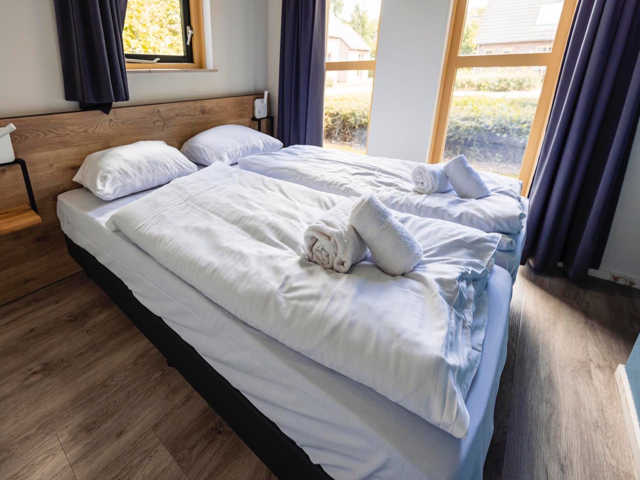 Een slaapkamer van Vakantiepark 't Broeckhuys 1 in Ewijk