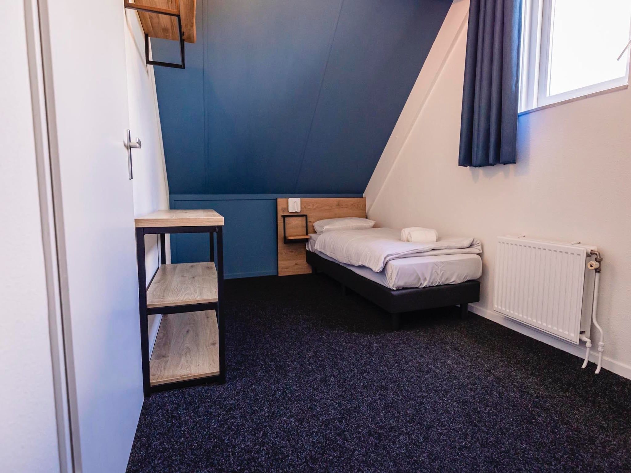 Een slaapkamer van Vakantiepark 't Broeckhuys 1 in Ewijk