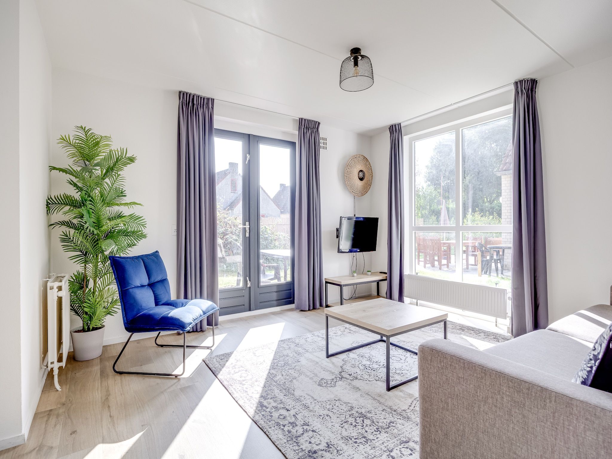 De woonkamer van Vakantiepark 't Broeckhuys 1 in Ewijk