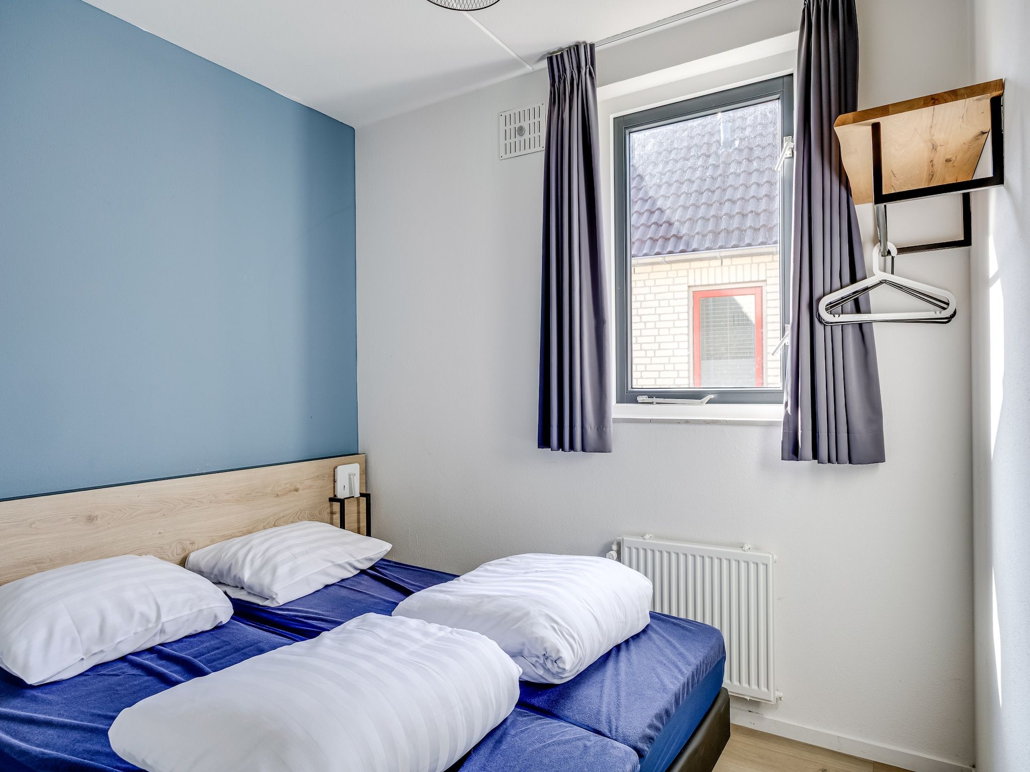 Een slaapkamer van Vakantiepark 't Broeckhuys 1 in Ewijk