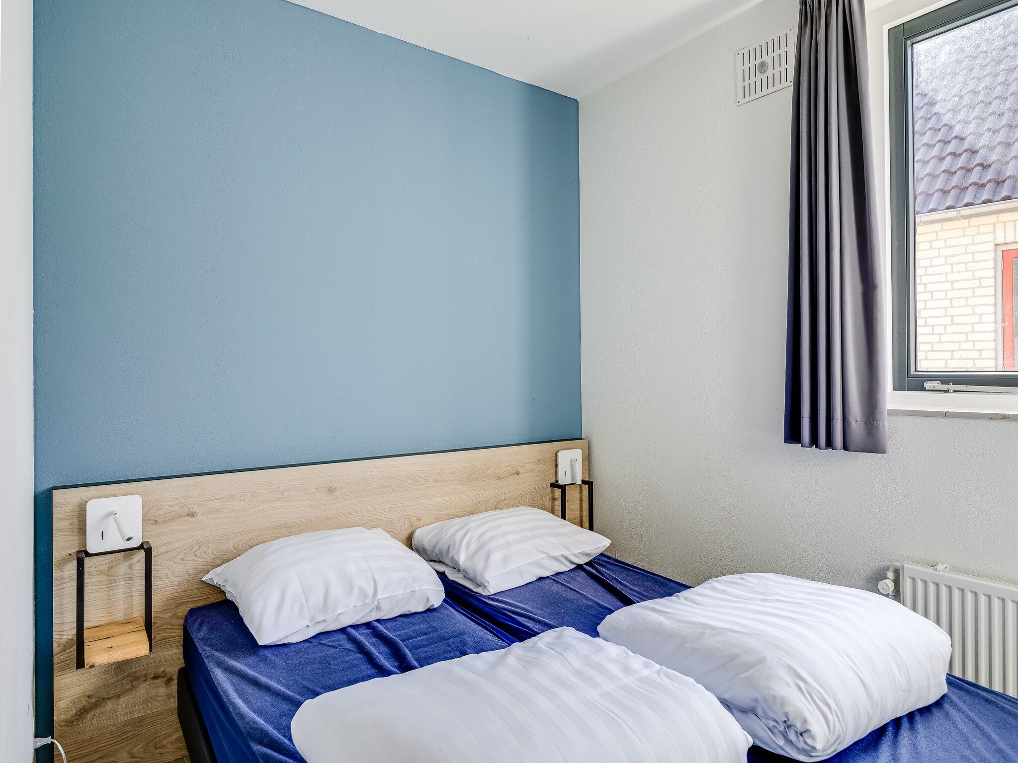 Een slaapkamer van Vakantiepark 't Broeckhuys 1 in Ewijk