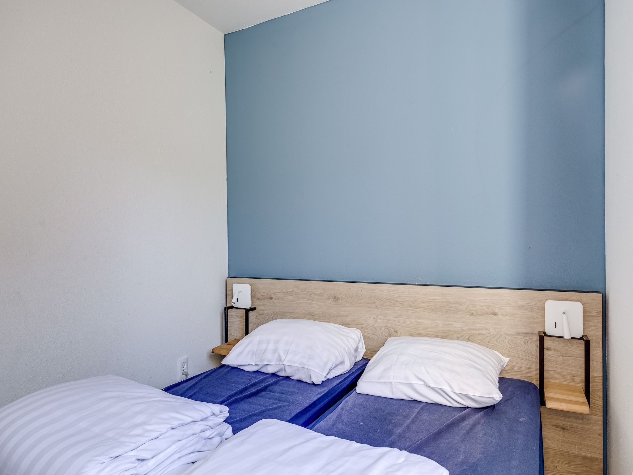 Een slaapkamer van Vakantiepark 't Broeckhuys 1 in Ewijk