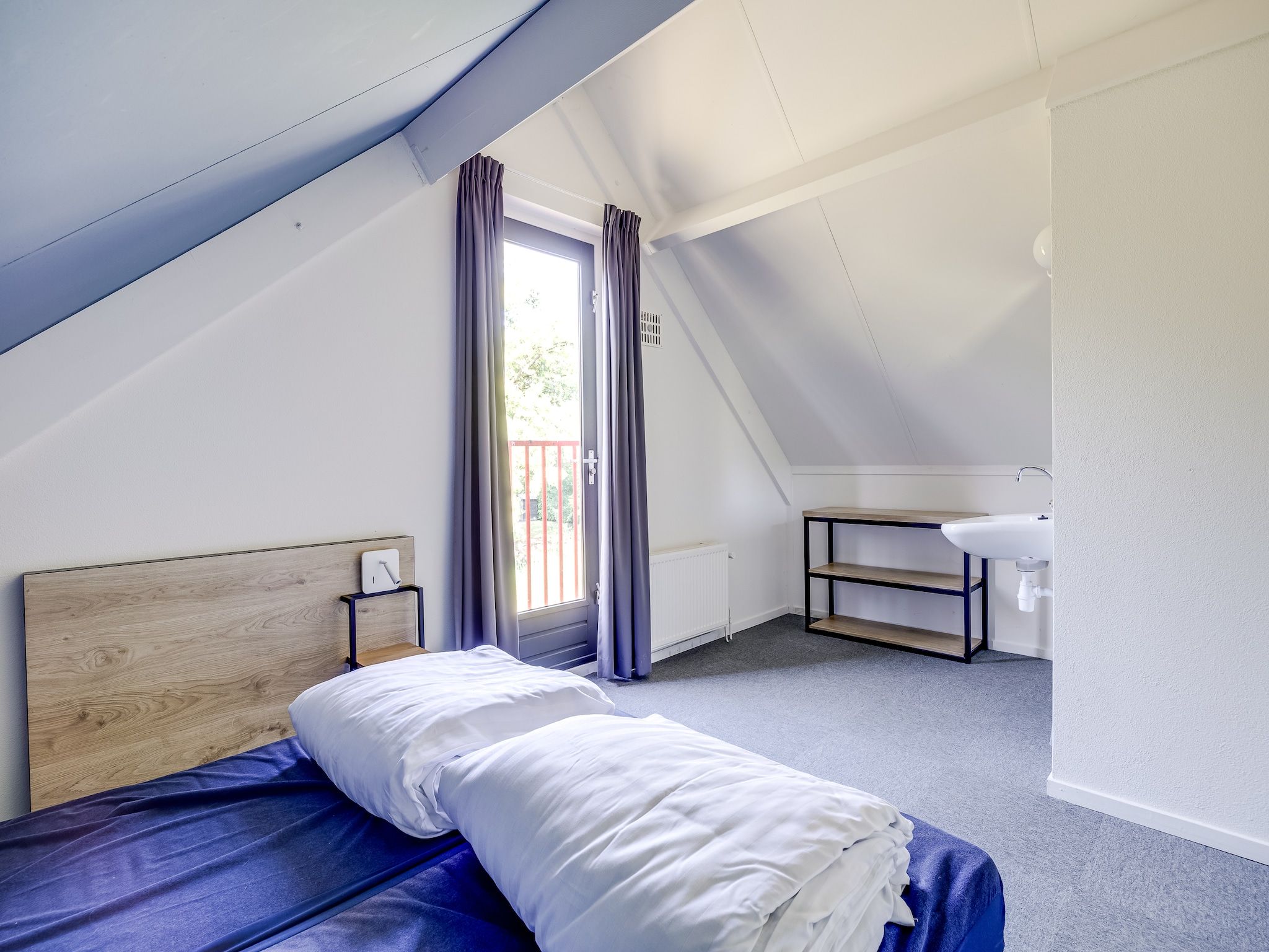 Een slaapkamer van Vakantiepark 't Broeckhuys 1 in Ewijk