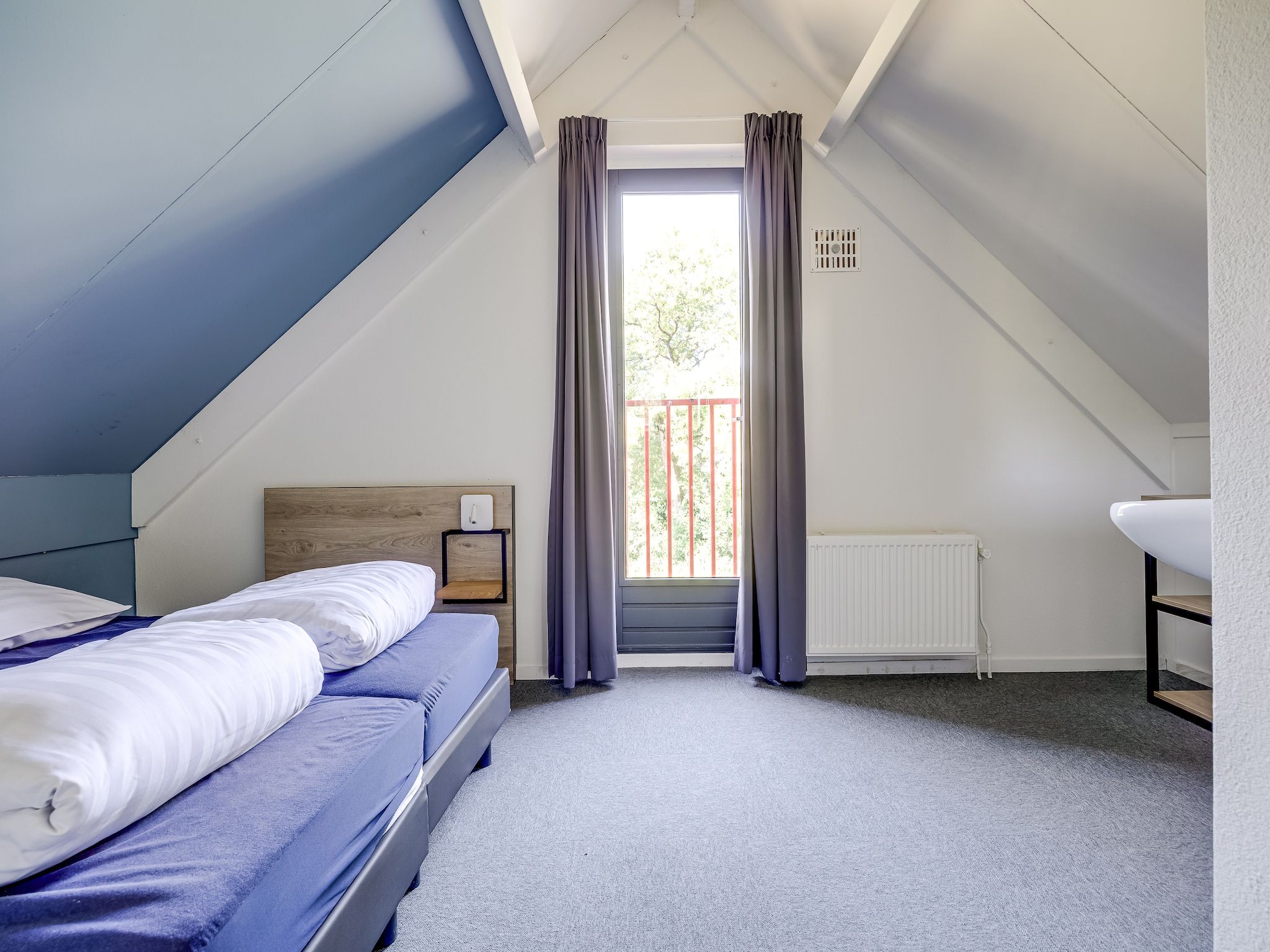 Een slaapkamer van Vakantiepark 't Broeckhuys 1 in Ewijk