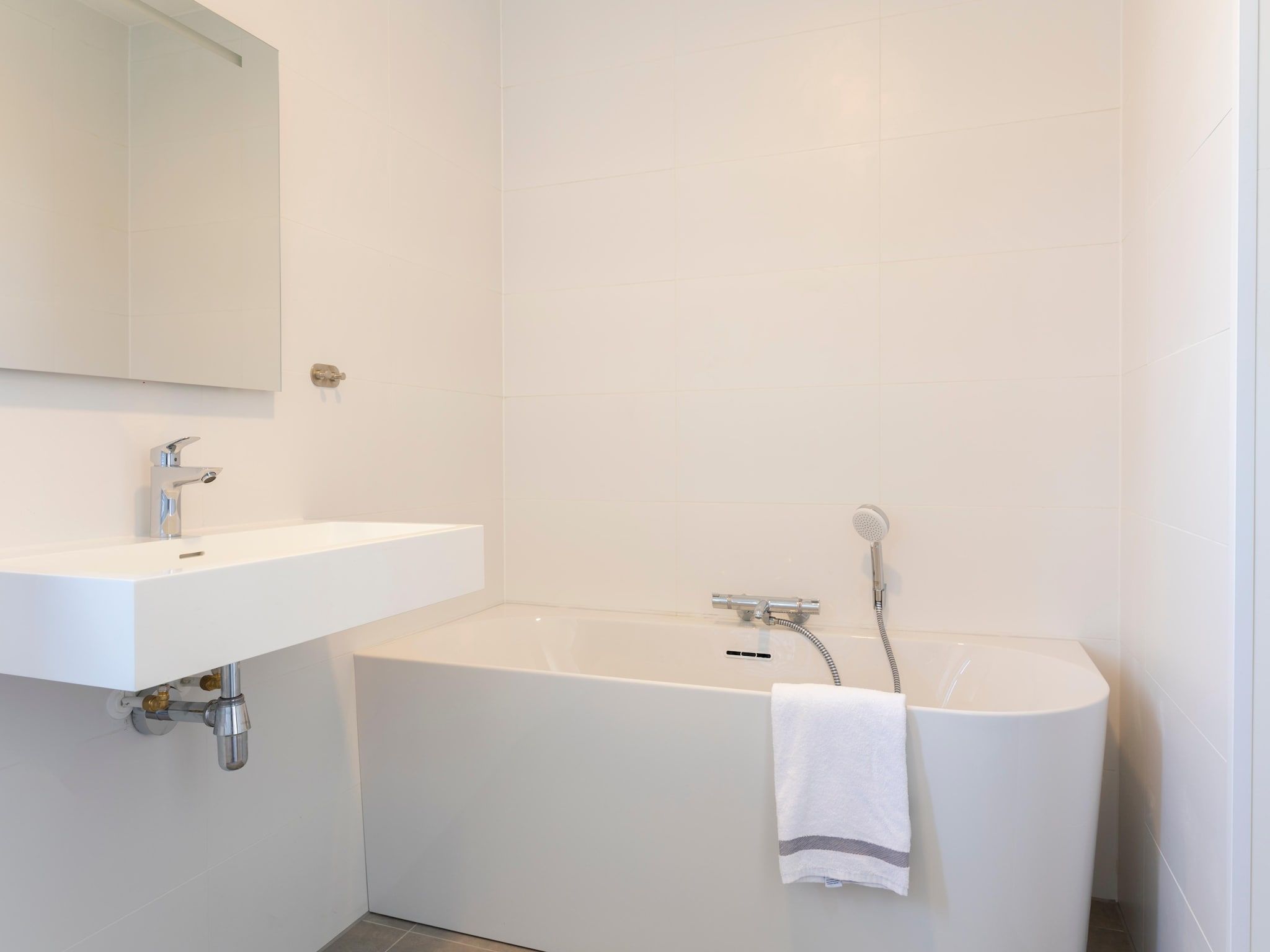 De badkamer van Resort Nieuwvliet-Bad 12 in Nieuwvliet