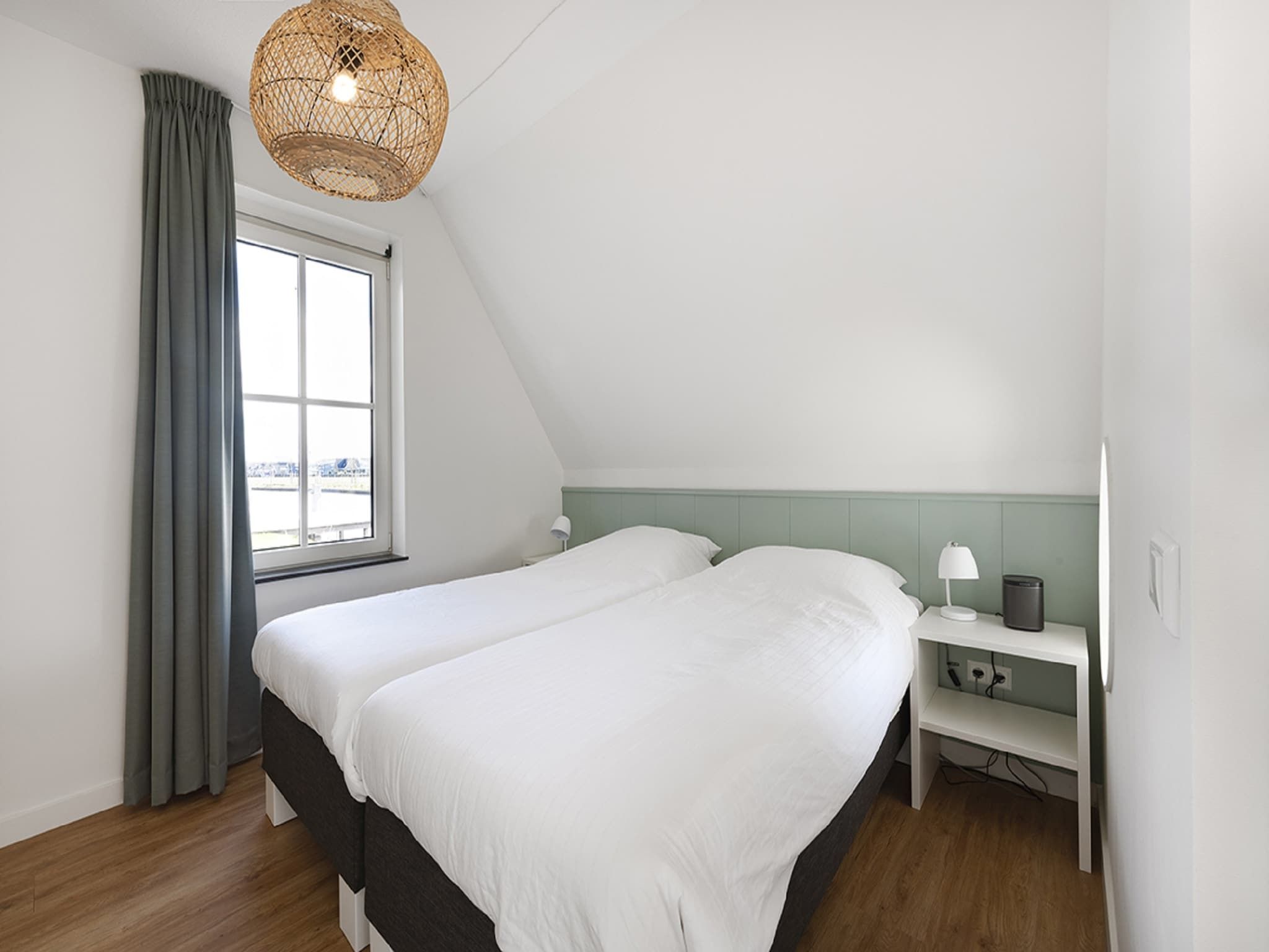 Een slaapkamer van Friese Meren Villa's 22 in Delfstrahuizen