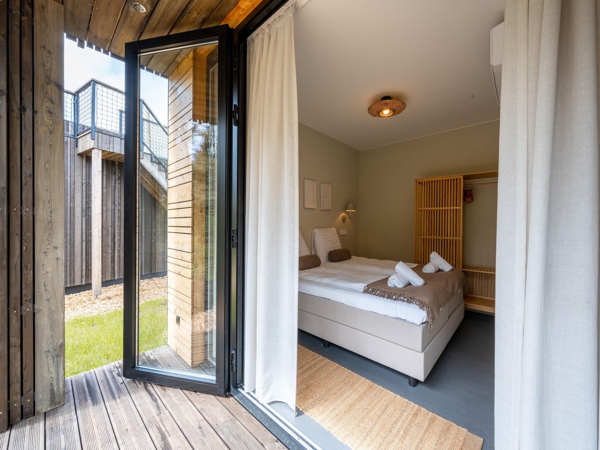 Een slaapkamer van Resort de Parel 7 in Zeewolde