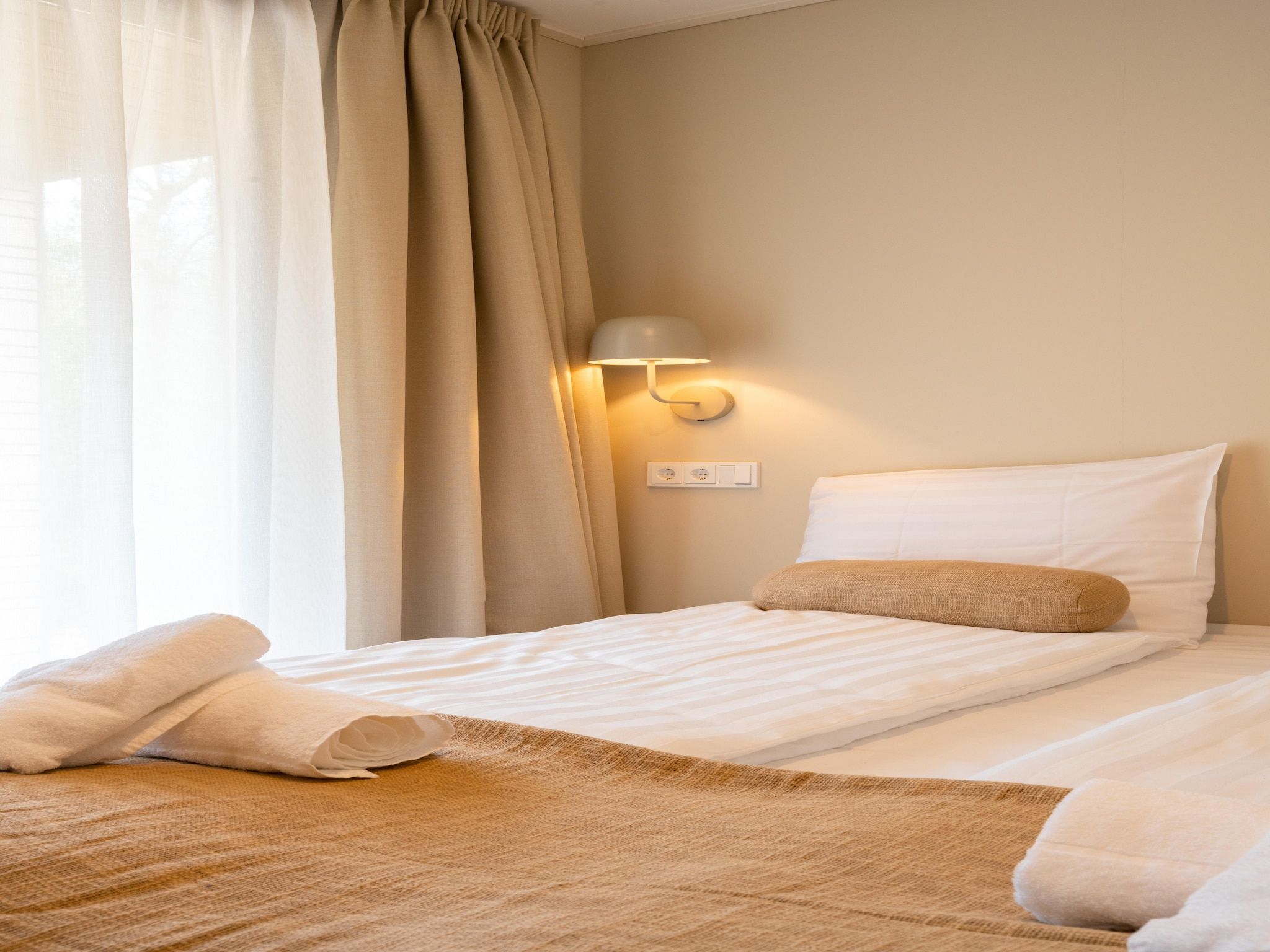 Een slaapkamer van Resort de Parel 15 in Zeewolde