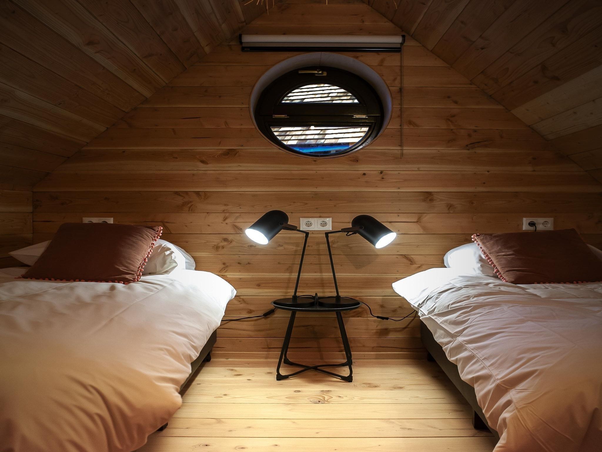 Een slaapkamer van Vakantiepark Sandberghe 13 in Uden