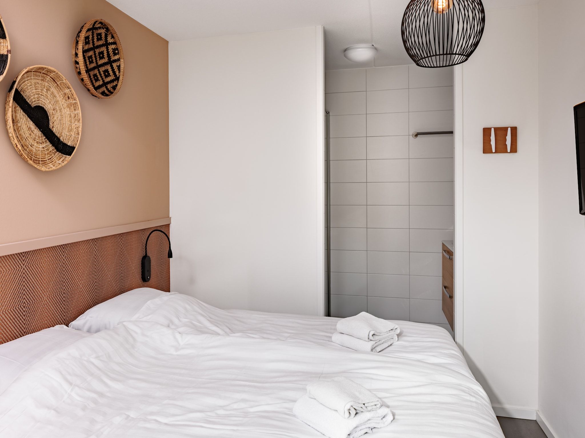 Een slaapkamer van Duinresort Dunimar 3 in Noordwijkerhout