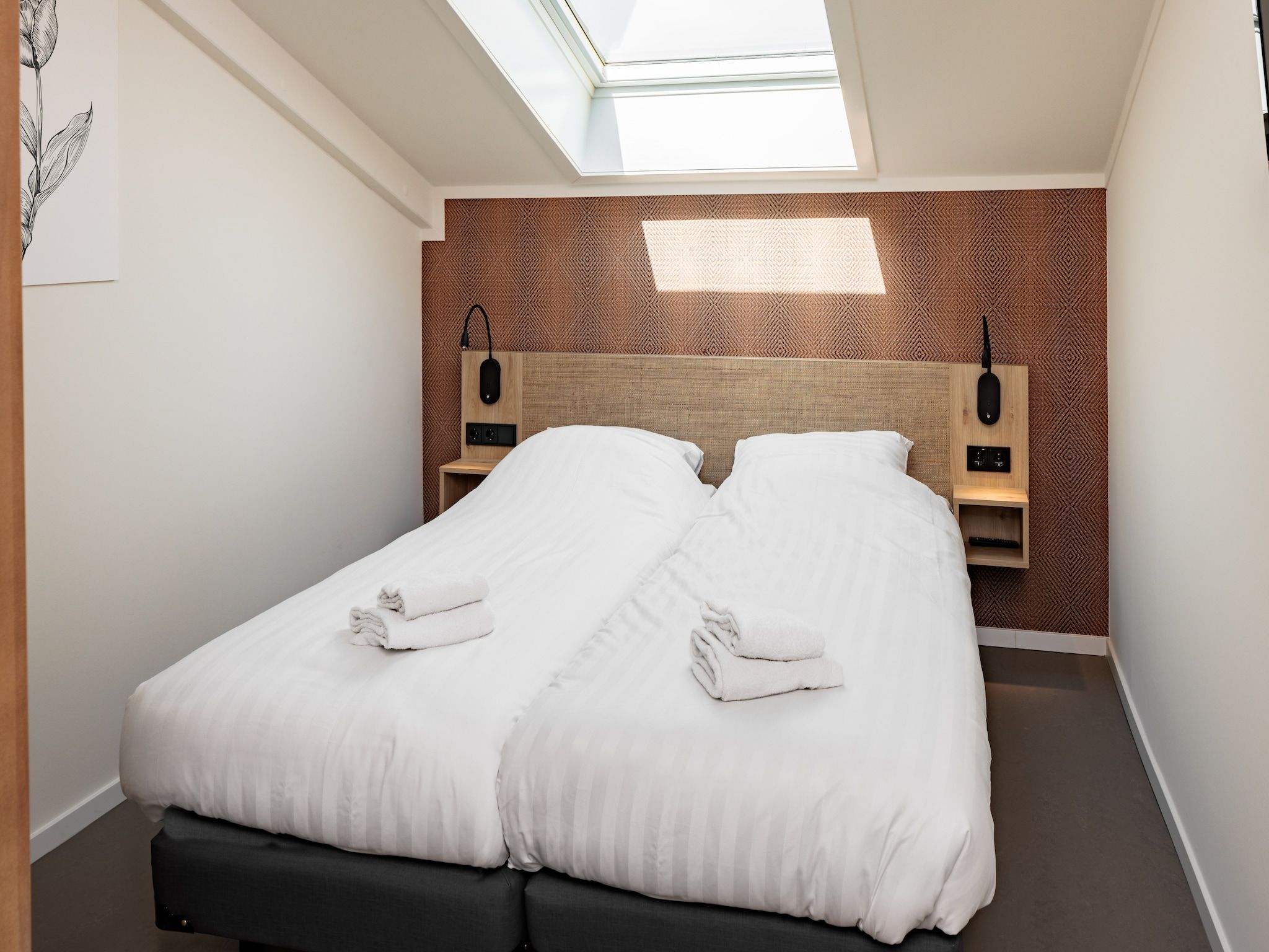 Een slaapkamer van Duinresort Dunimar 4 in Noordwijkerhout