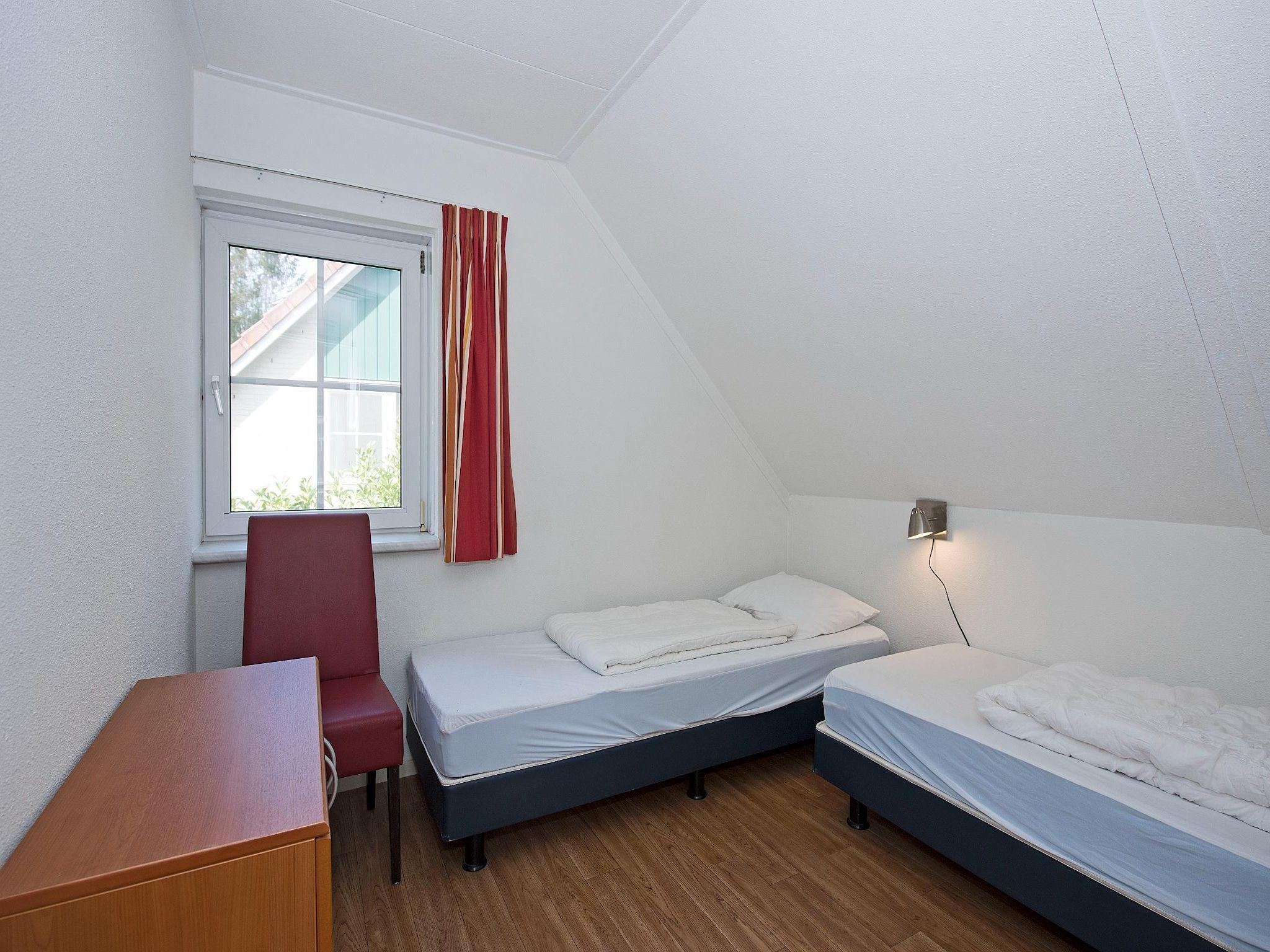 Een slaapkamer van Vakantiepark Hellendoorn 4 in Hellendoorn