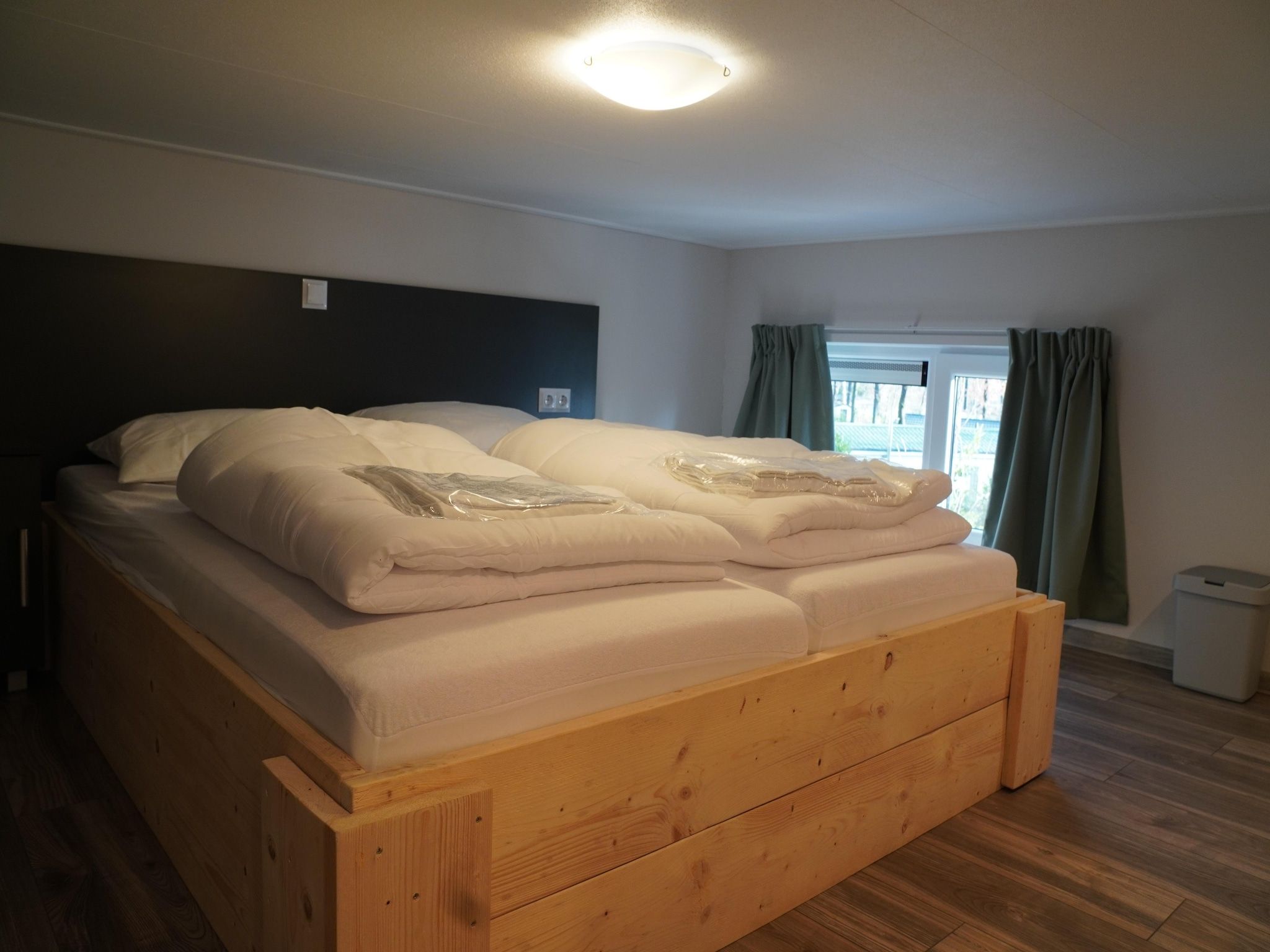 Een slaapkamer van Vakantiepark De Rimboe & De Woeste Hoogte 41 in Hoenderloo