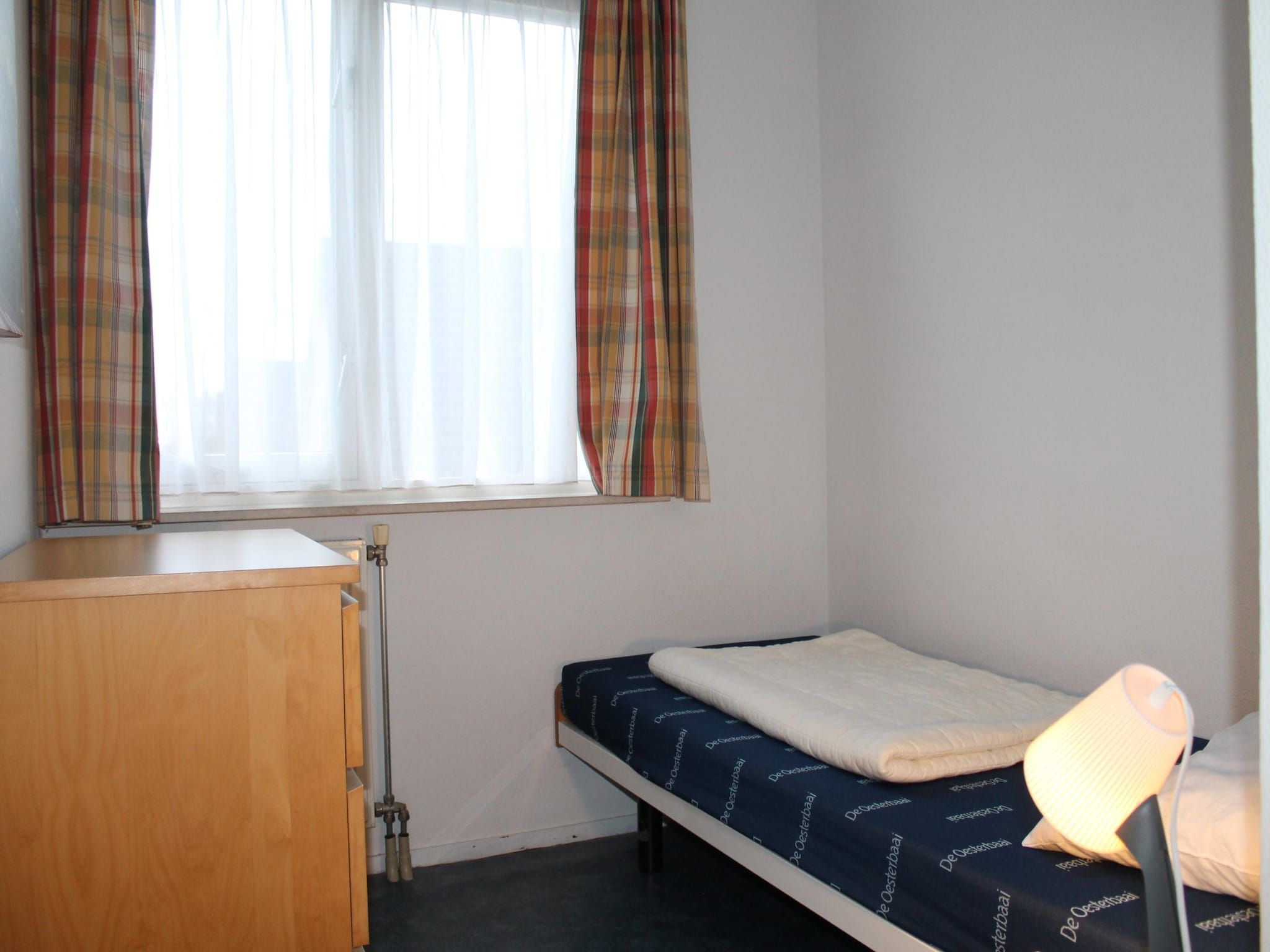 Een slaapkamer van Villapark De Oesterbaai 81 in Wemeldinge