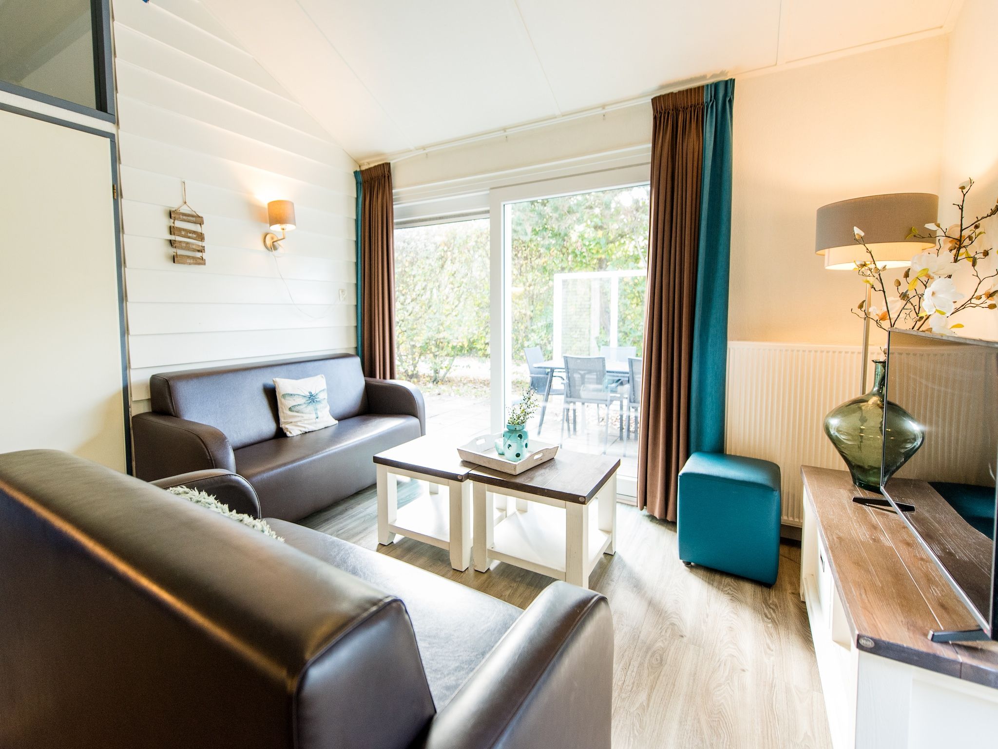 De woonkamer van Vakantiepark Boomhiemke 17 in Hollum