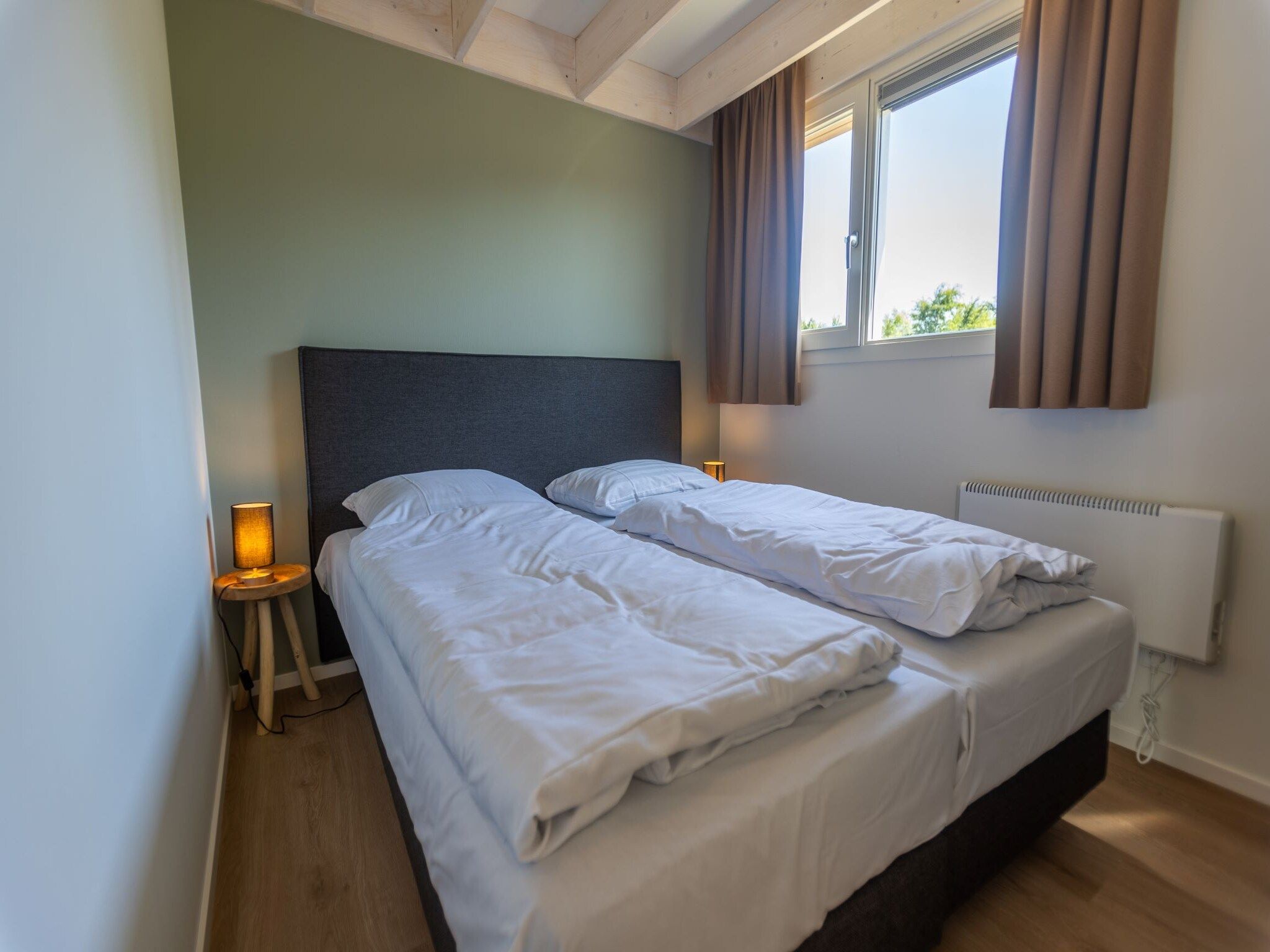 Een slaapkamer van Duinvilla 8 in Cadzand