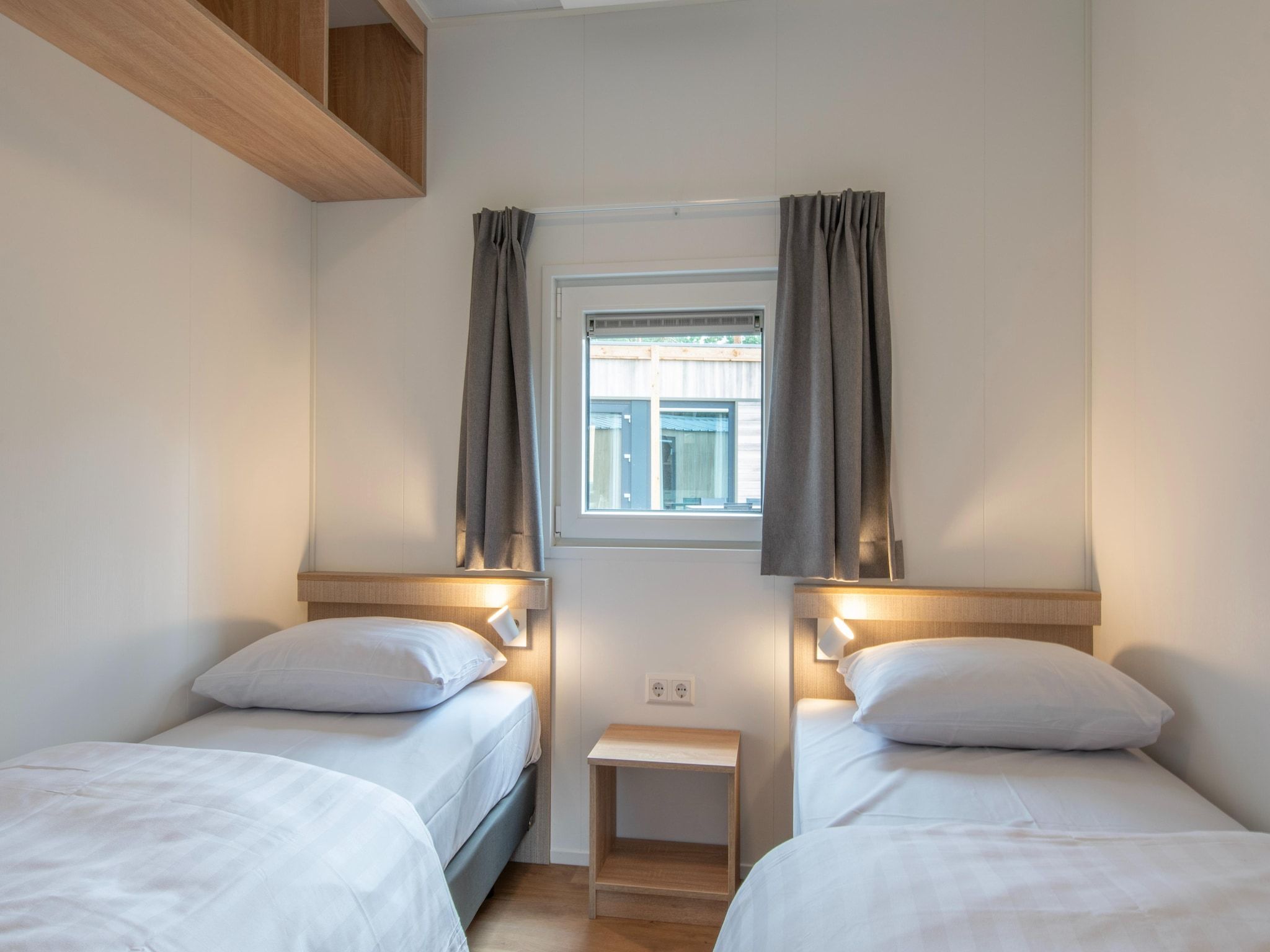 Een slaapkamer van Bospark 't Wolfsven 19 in Mierlo