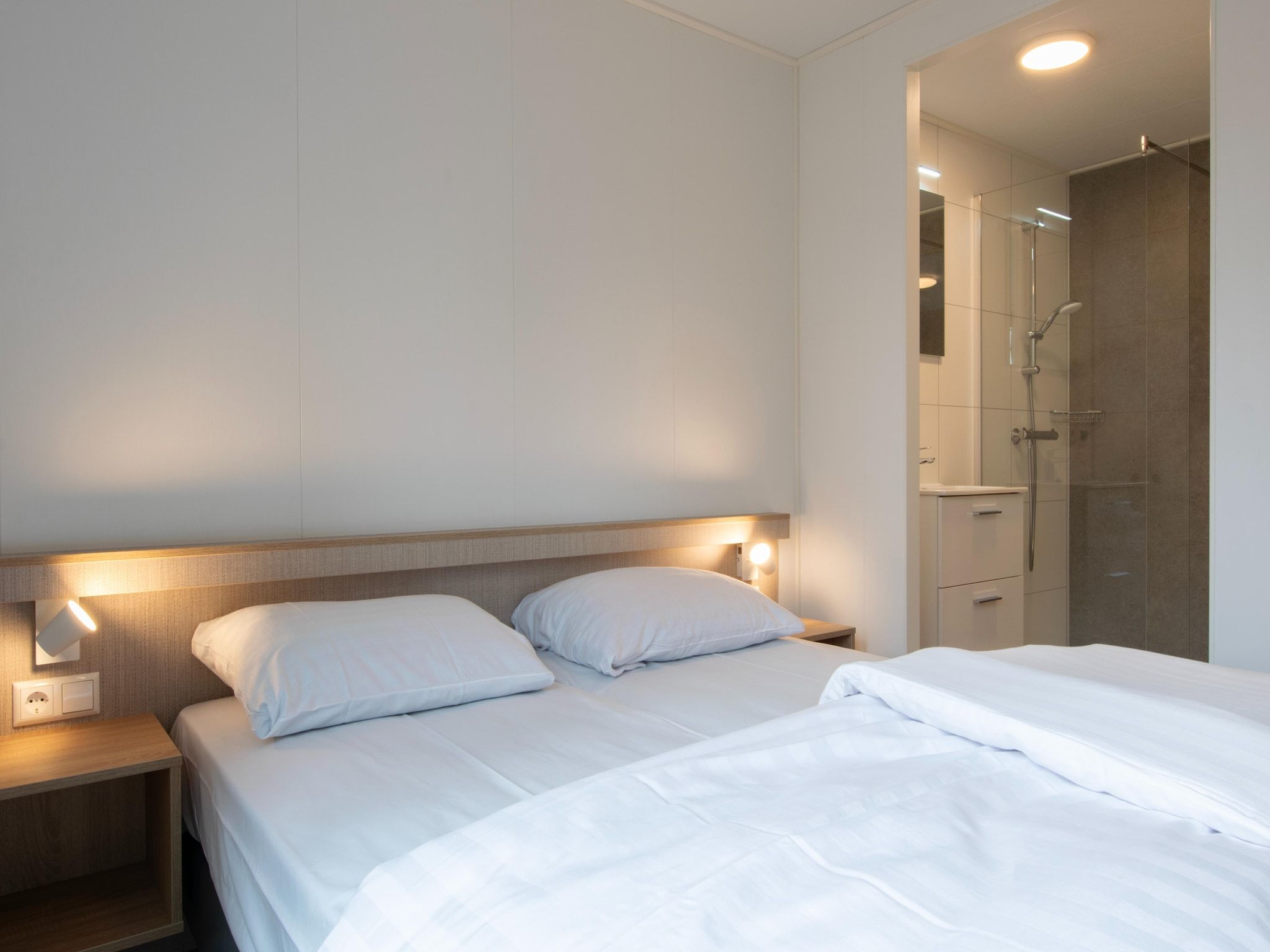 Een slaapkamer van Bospark 't Wolfsven 21 in Mierlo