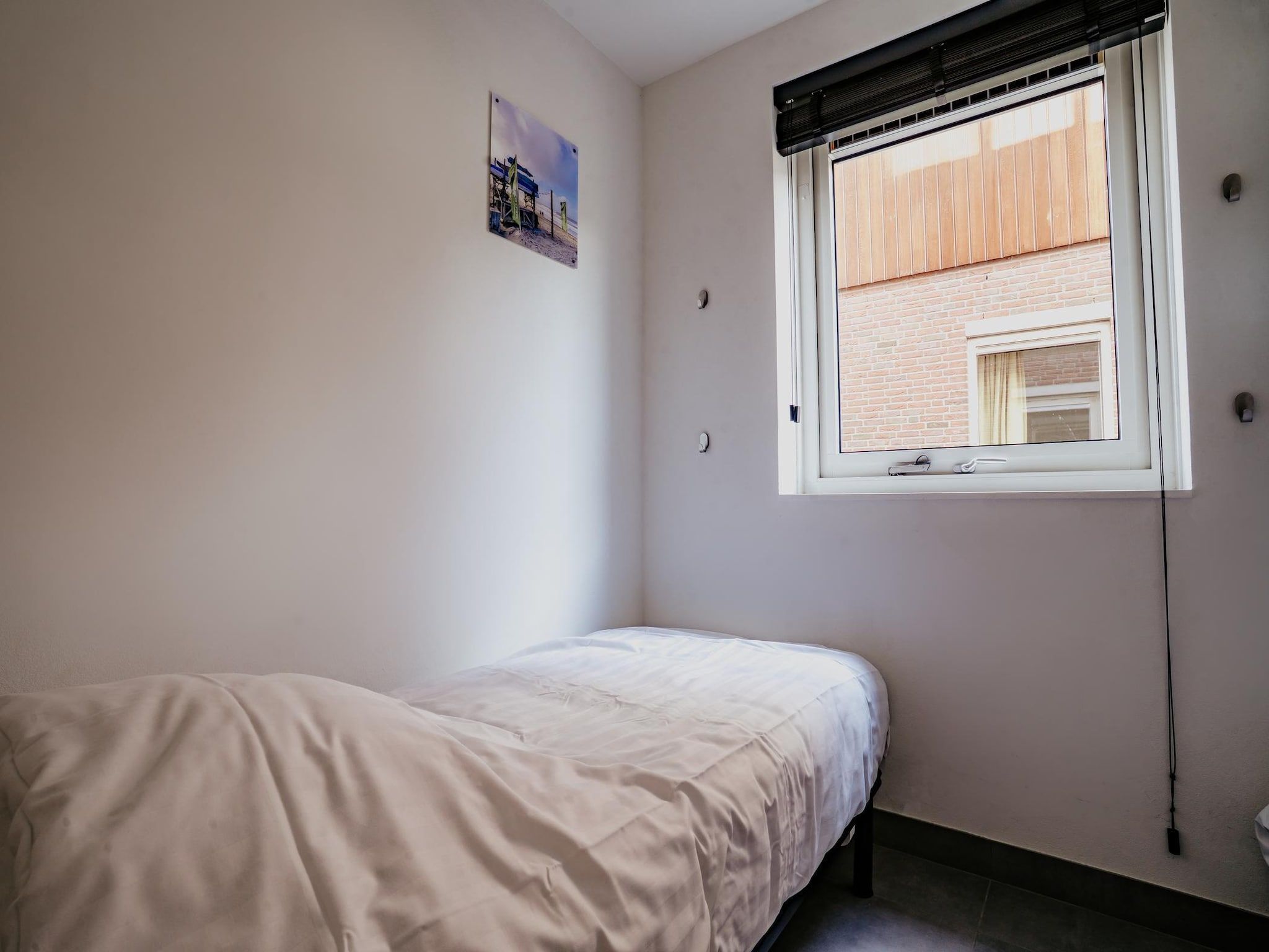 Een slaapkamer van Waterpark de Meerparel 13 in Uitgeest