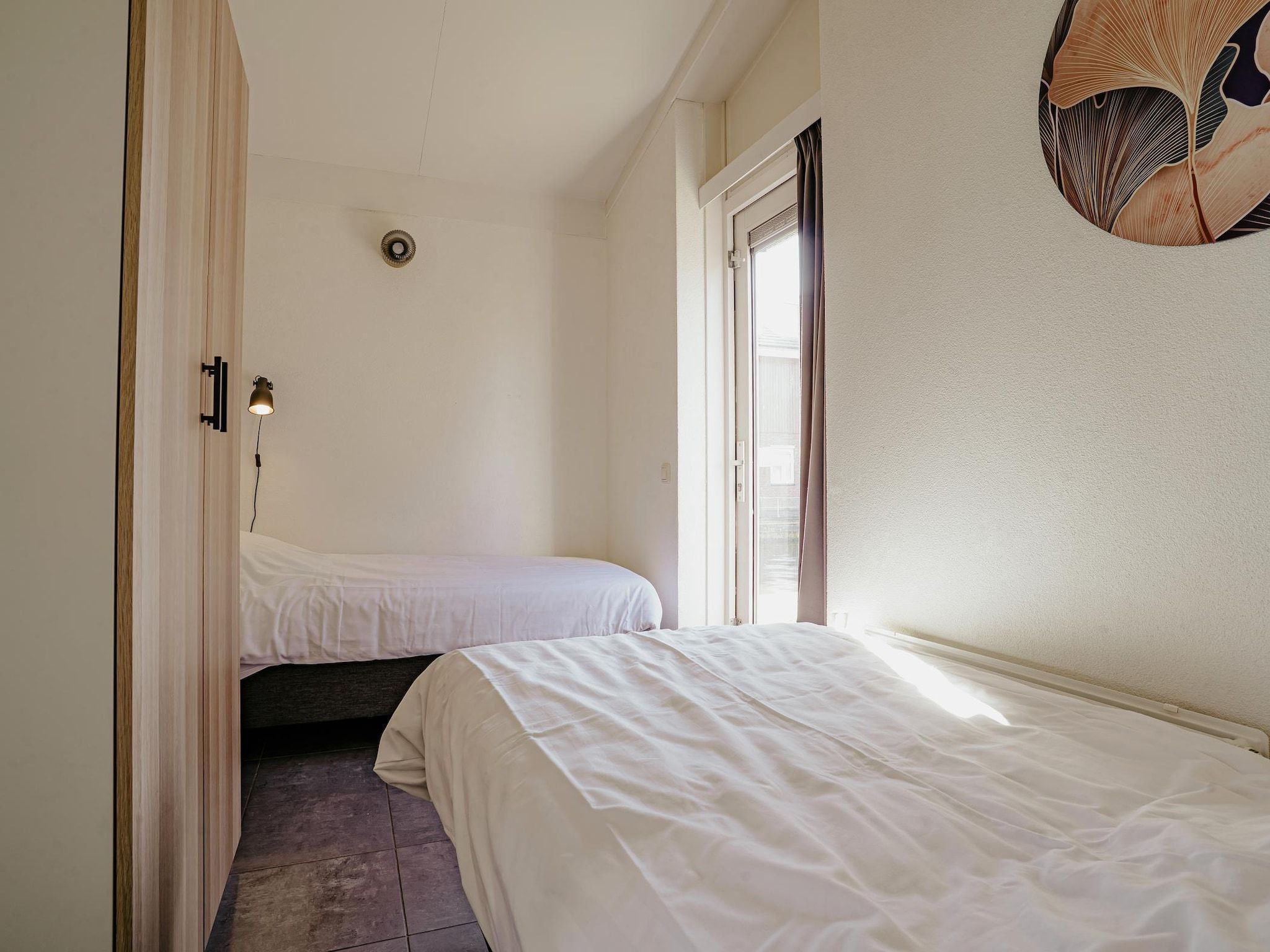 Een slaapkamer van Waterpark de Meerparel 13 in Uitgeest