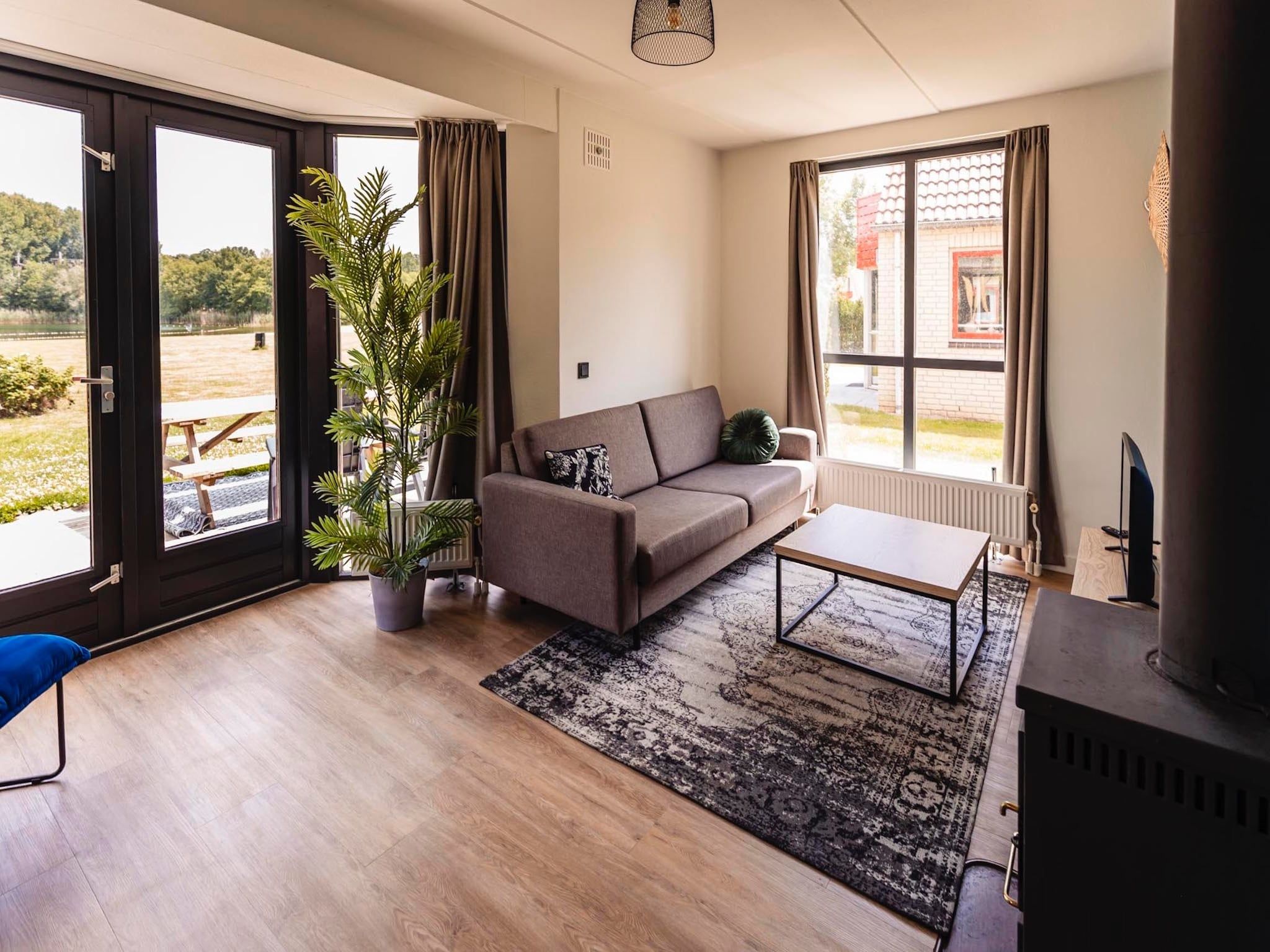 De woonkamer van Vakantiepark 't Broeckhuys 3 in Ewijk