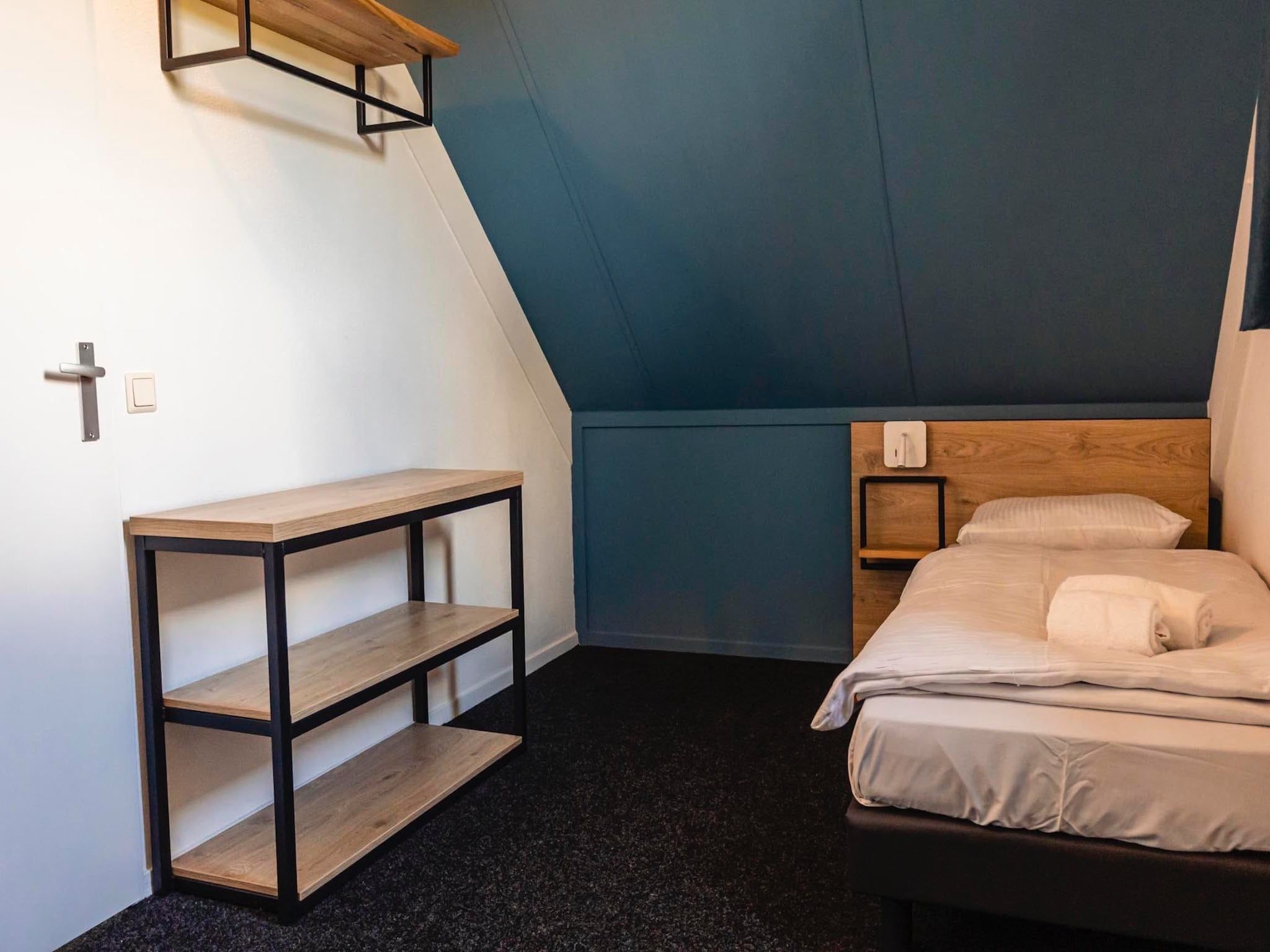 Een slaapkamer van Vakantiepark 't Broeckhuys 3 in Ewijk