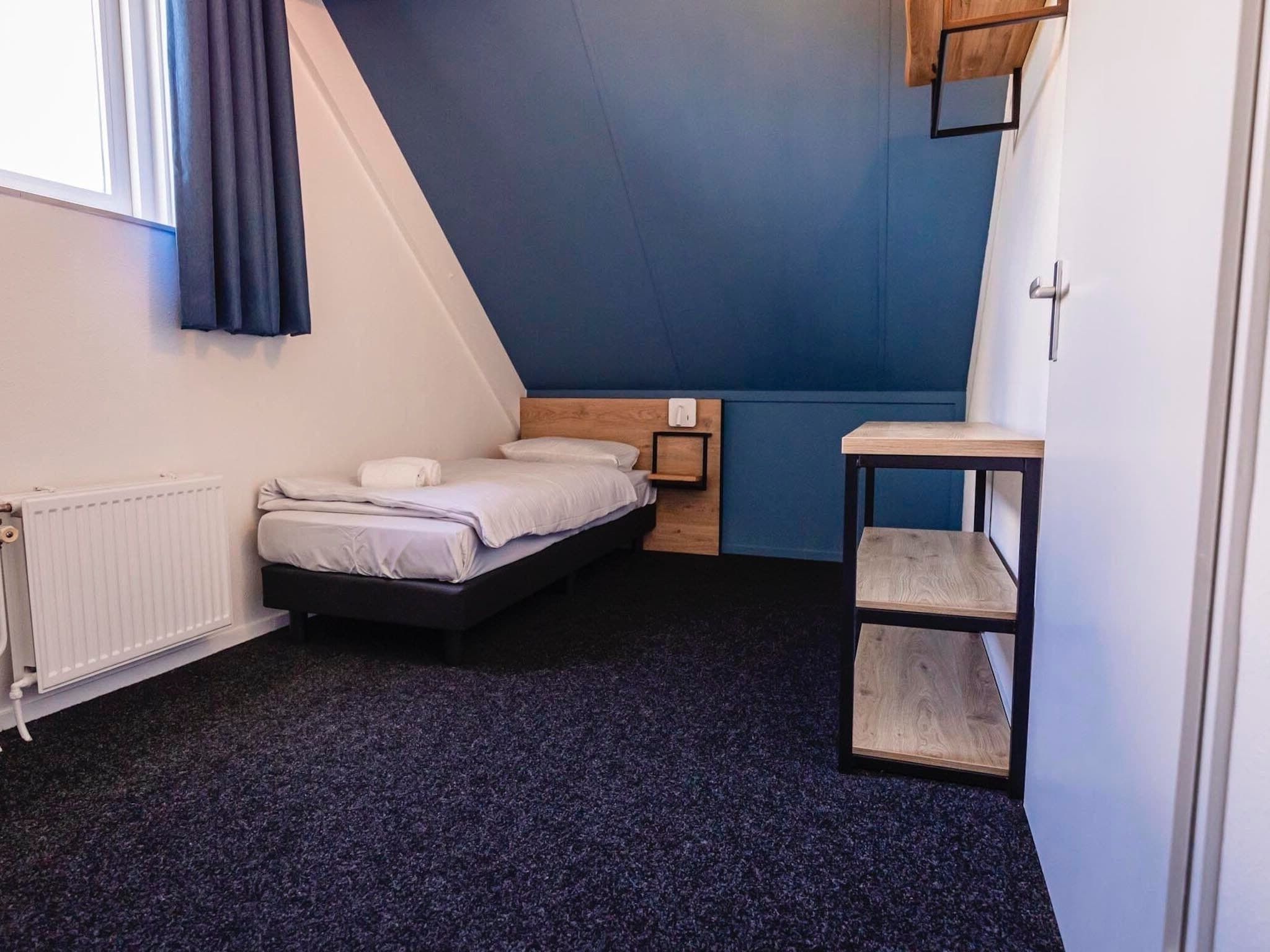 Een slaapkamer van Vakantiepark 't Broeckhuys 3 in Ewijk