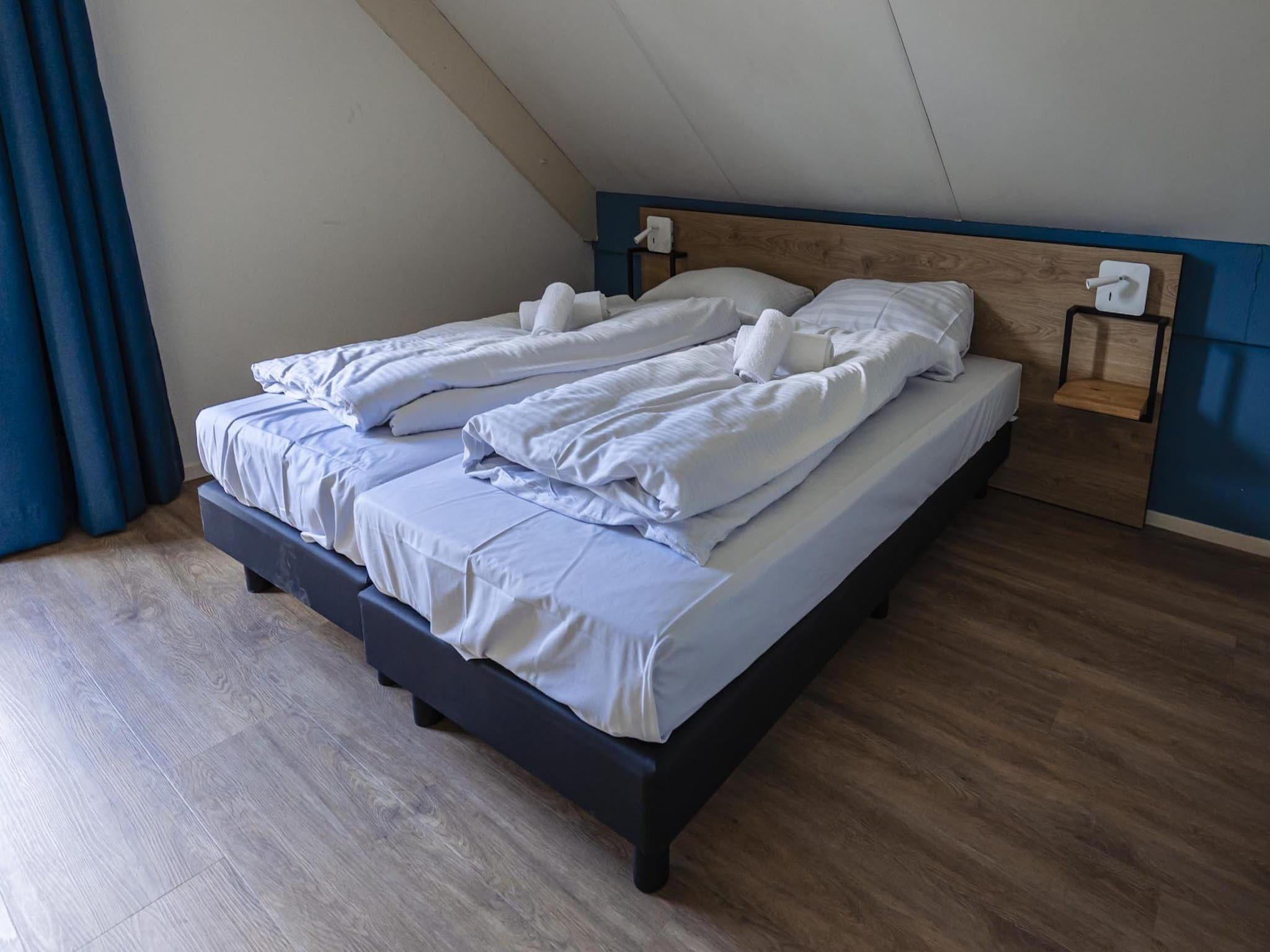 Een slaapkamer van Vakantiepark 't Broeckhuys 6 in Ewijk