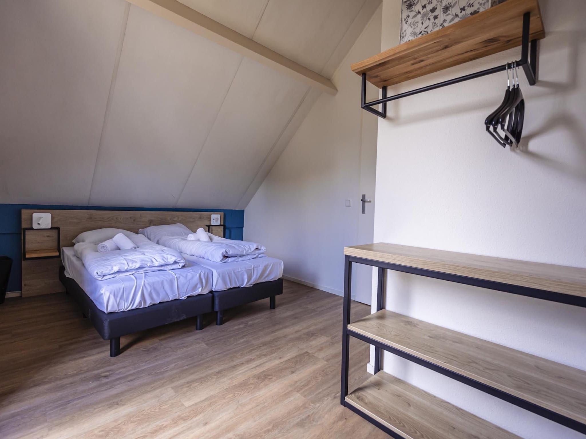 Een slaapkamer van Vakantiepark 't Broeckhuys 6 in Ewijk