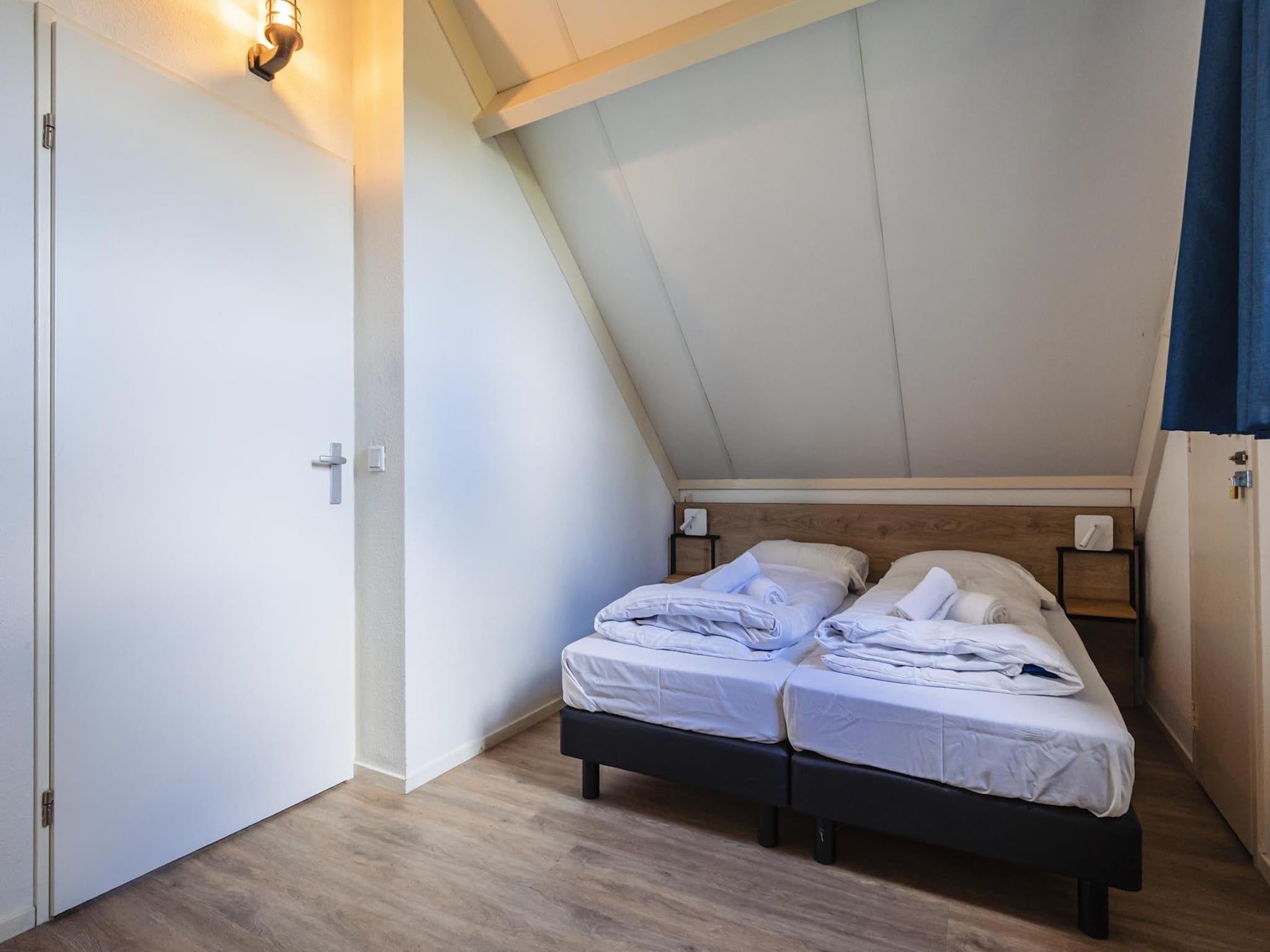 Een slaapkamer van Vakantiepark 't Broeckhuys 6 in Ewijk