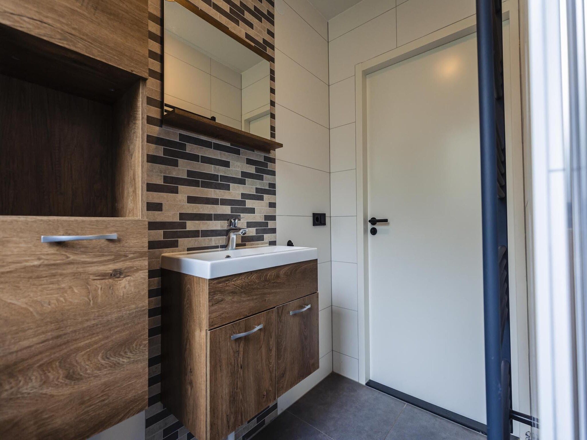 De badkamer van Vakantiepark 't Broeckhuys 8 in Ewijk