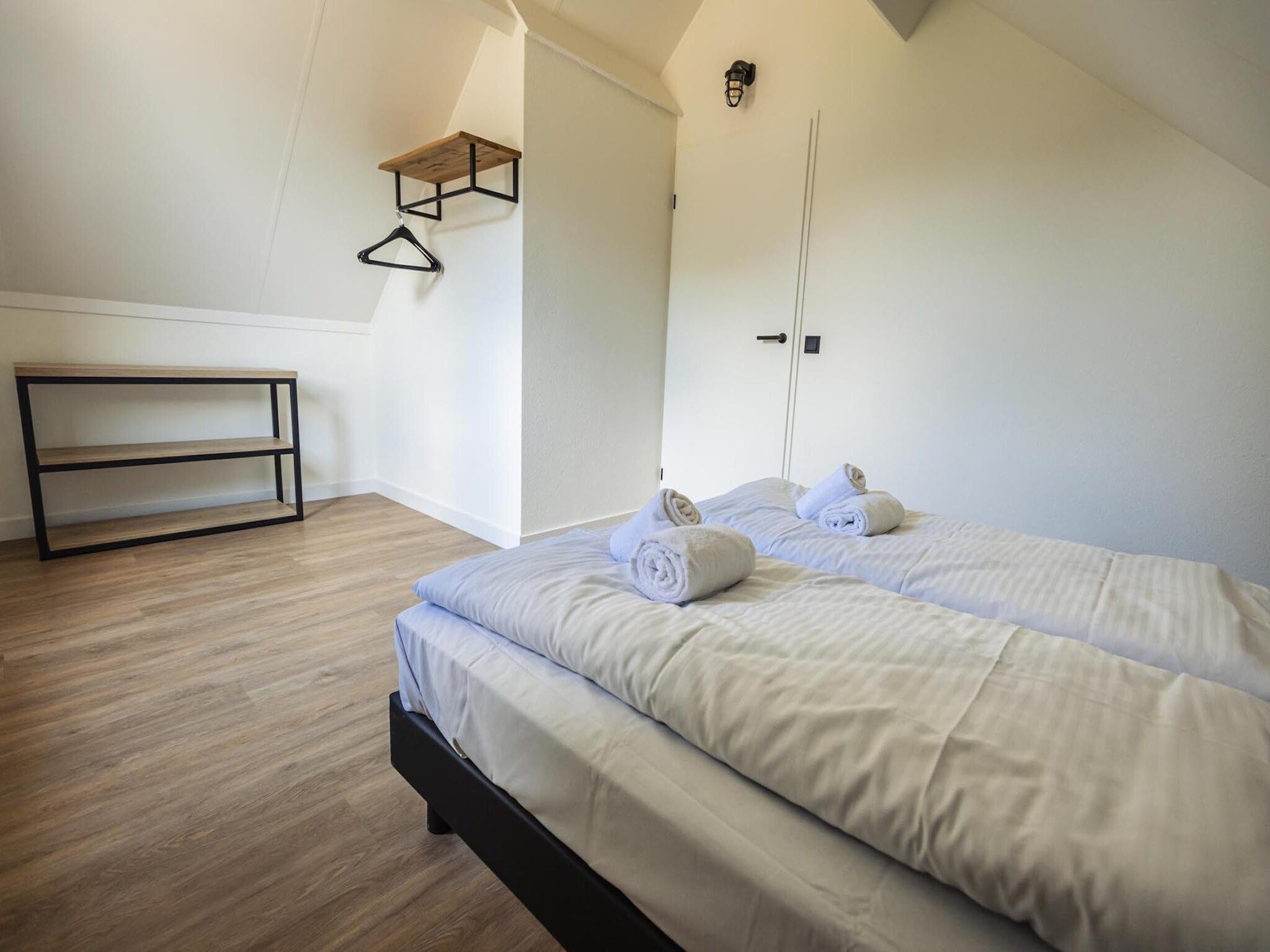 Een slaapkamer van Vakantiepark 't Broeckhuys 8 in Ewijk