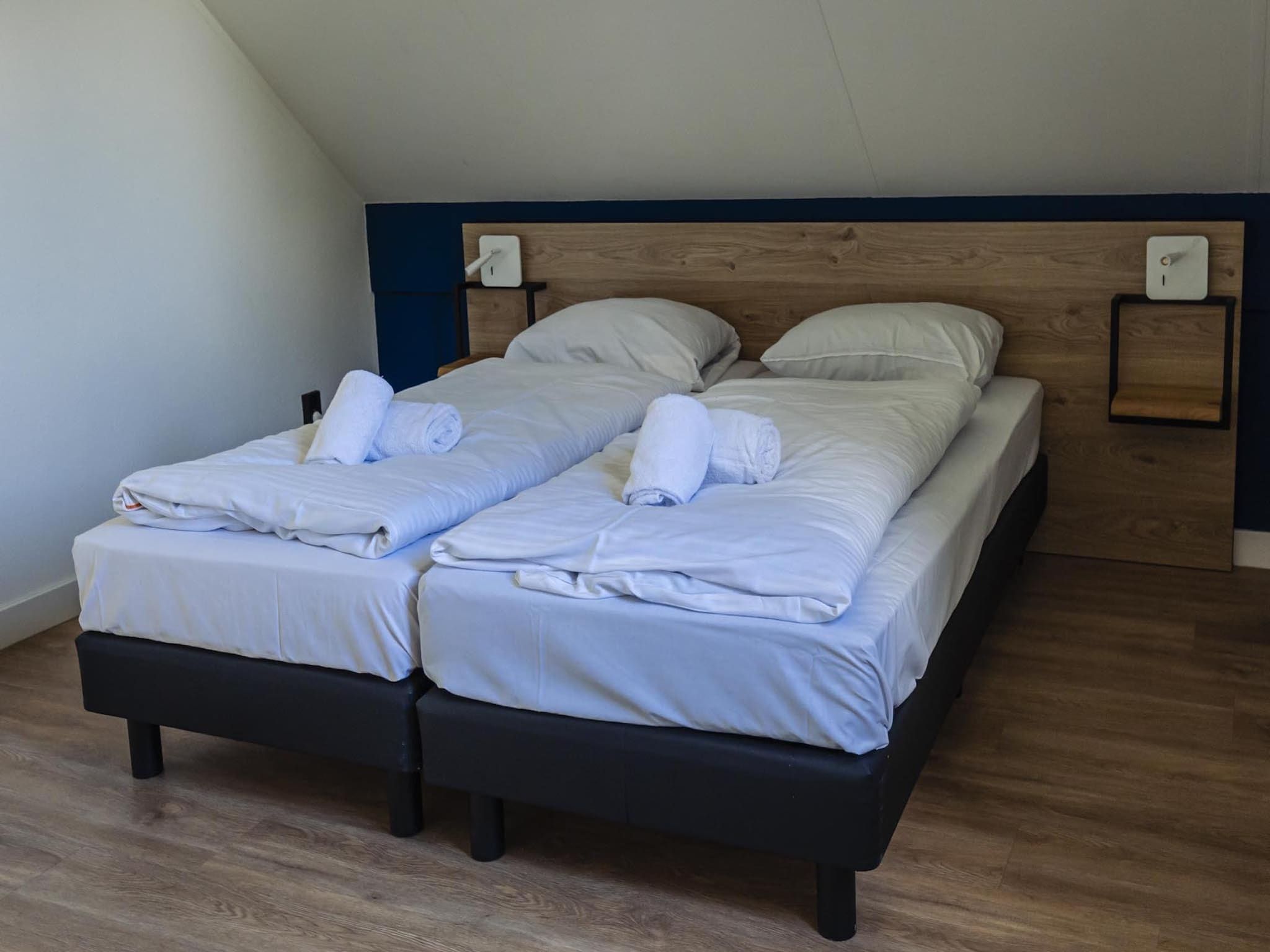 Een slaapkamer van Vakantiepark 't Broeckhuys 8 in Ewijk