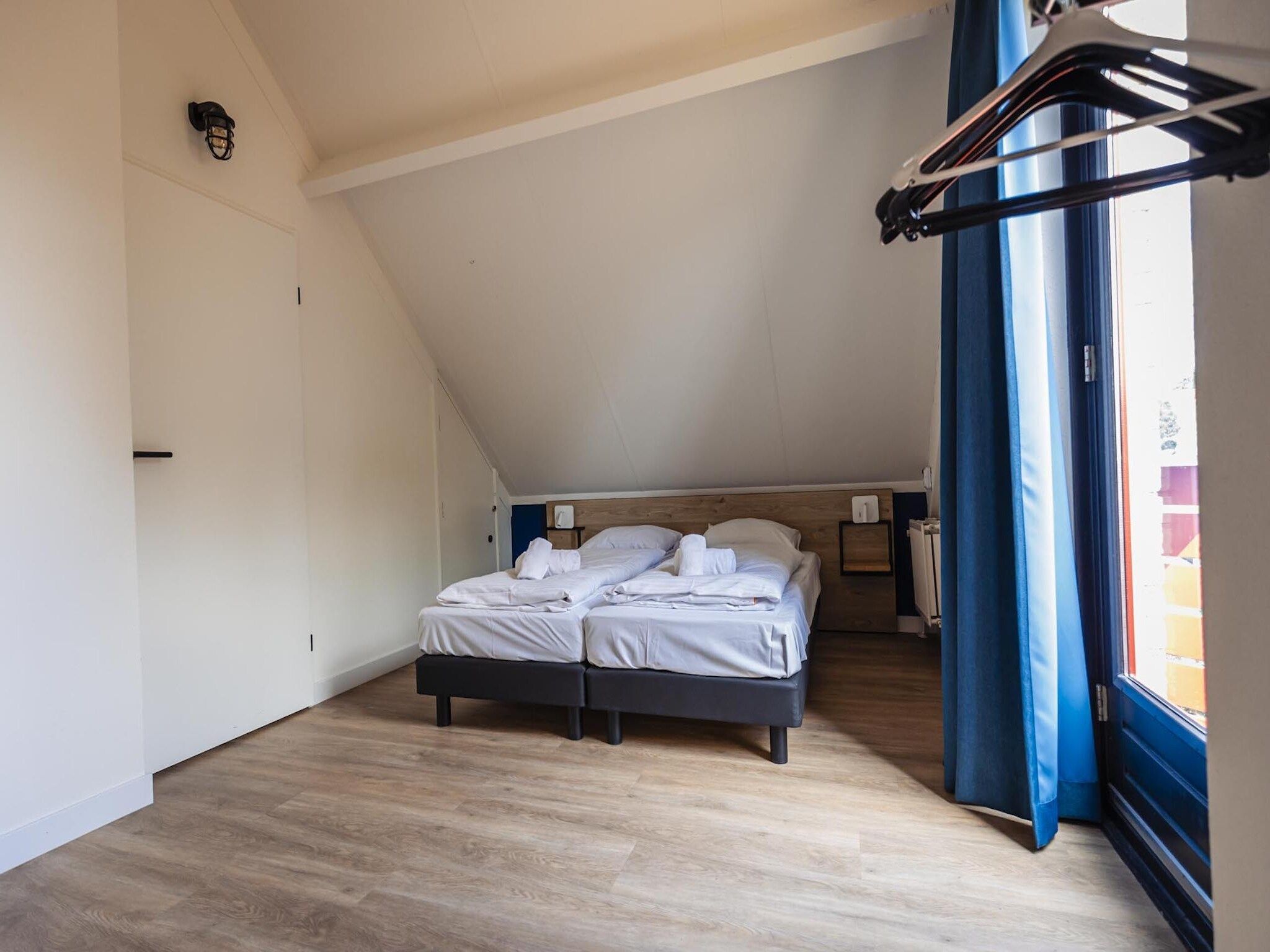 Een slaapkamer van Vakantiepark 't Broeckhuys 8 in Ewijk