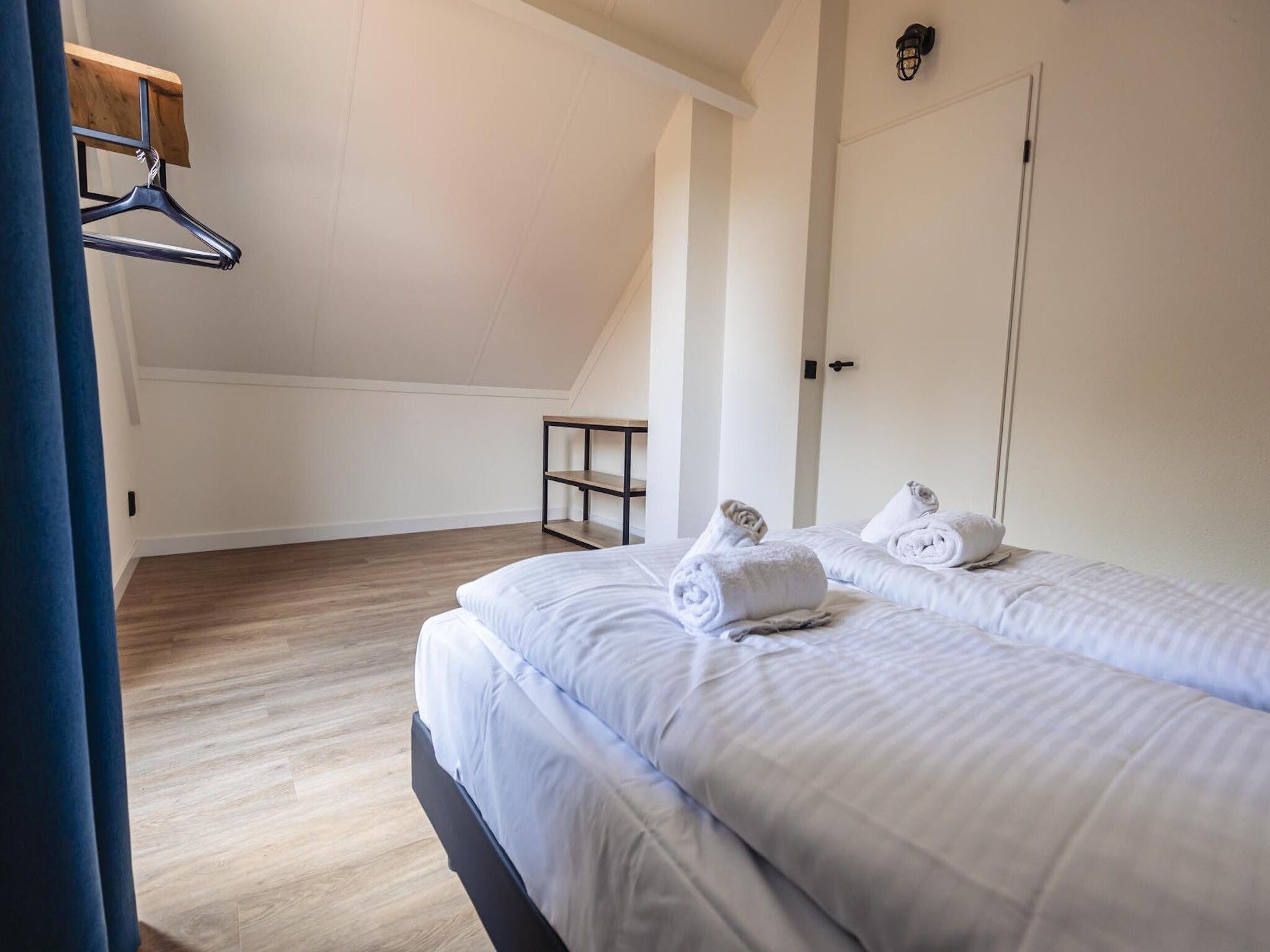 Een slaapkamer van Vakantiepark 't Broeckhuys 8 in Ewijk