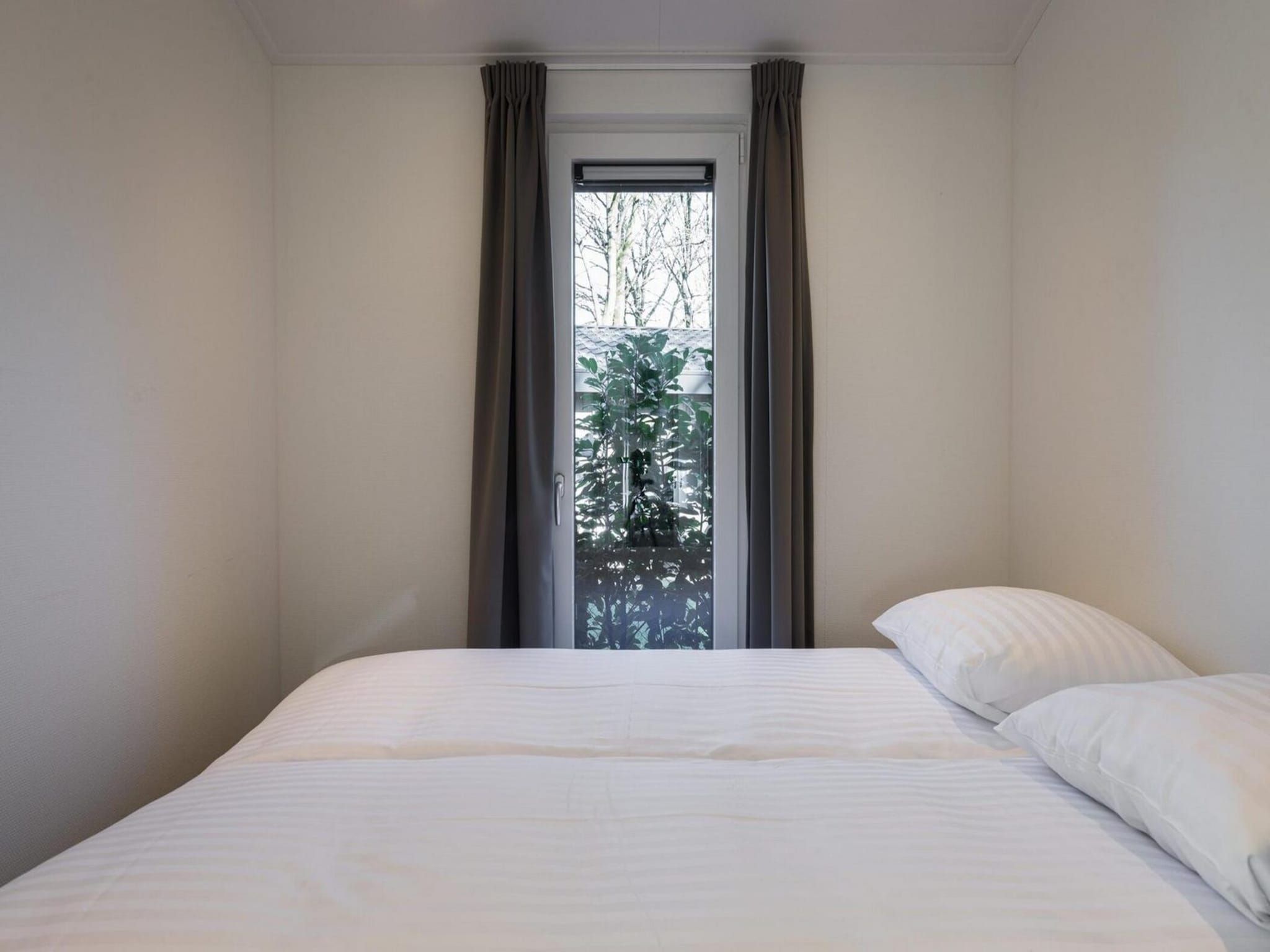 Een slaapkamer van Vakantiepark Latour 8 in Oirschot