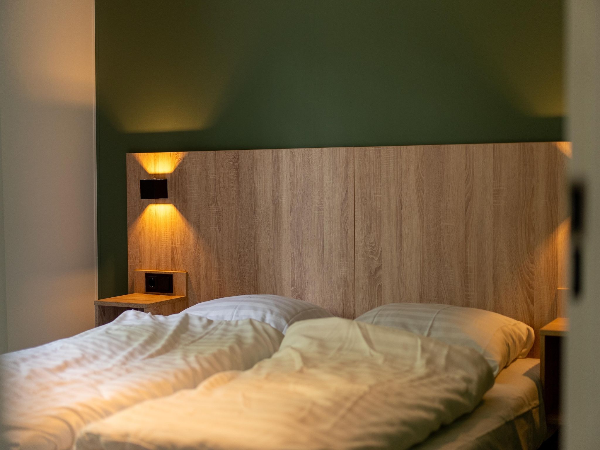 Een slaapkamer van Vakantiepark Hunzedal 18 in Borger