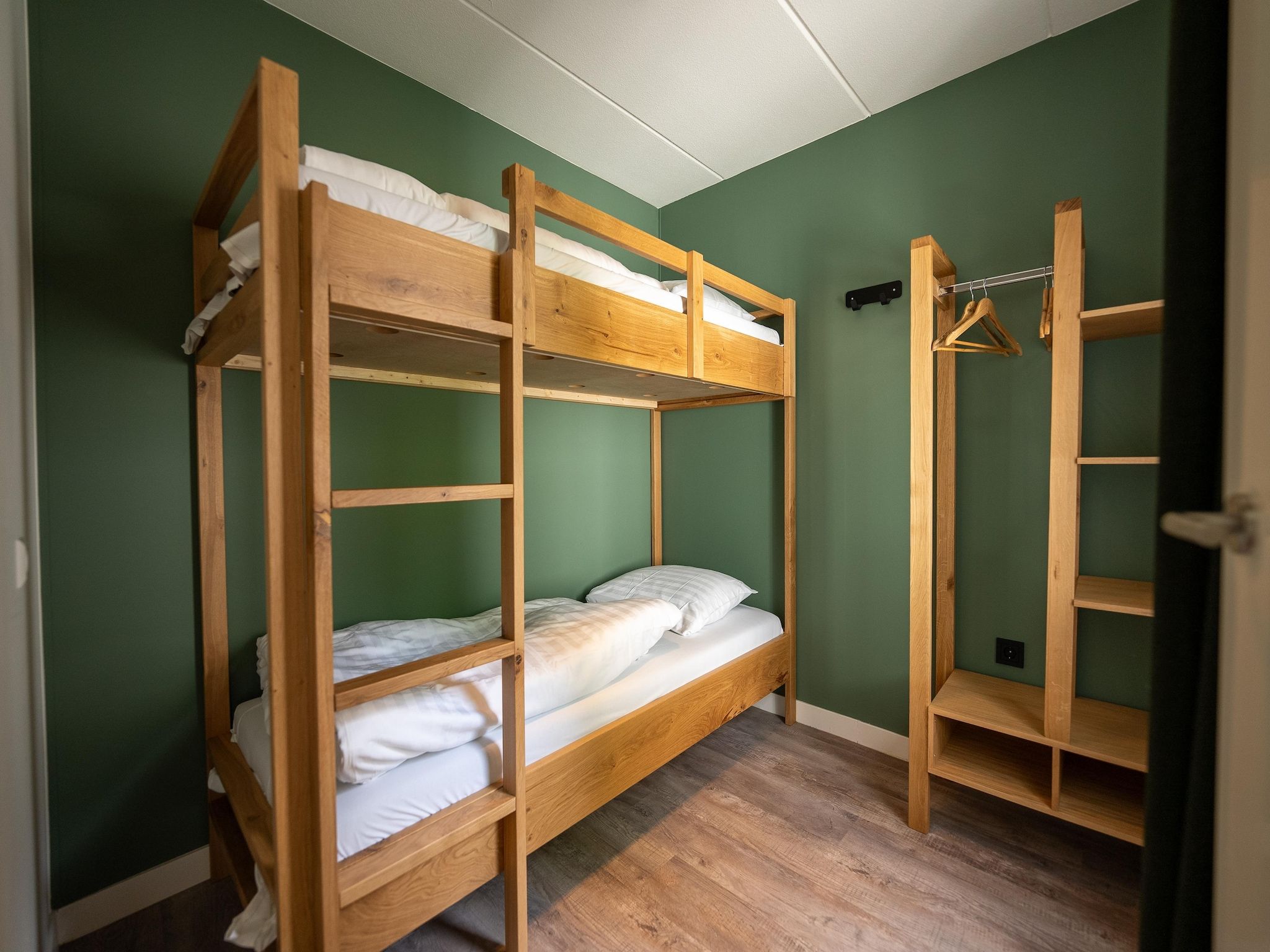 Een slaapkamer van Vakantiepark Hunzedal 19 in Borger