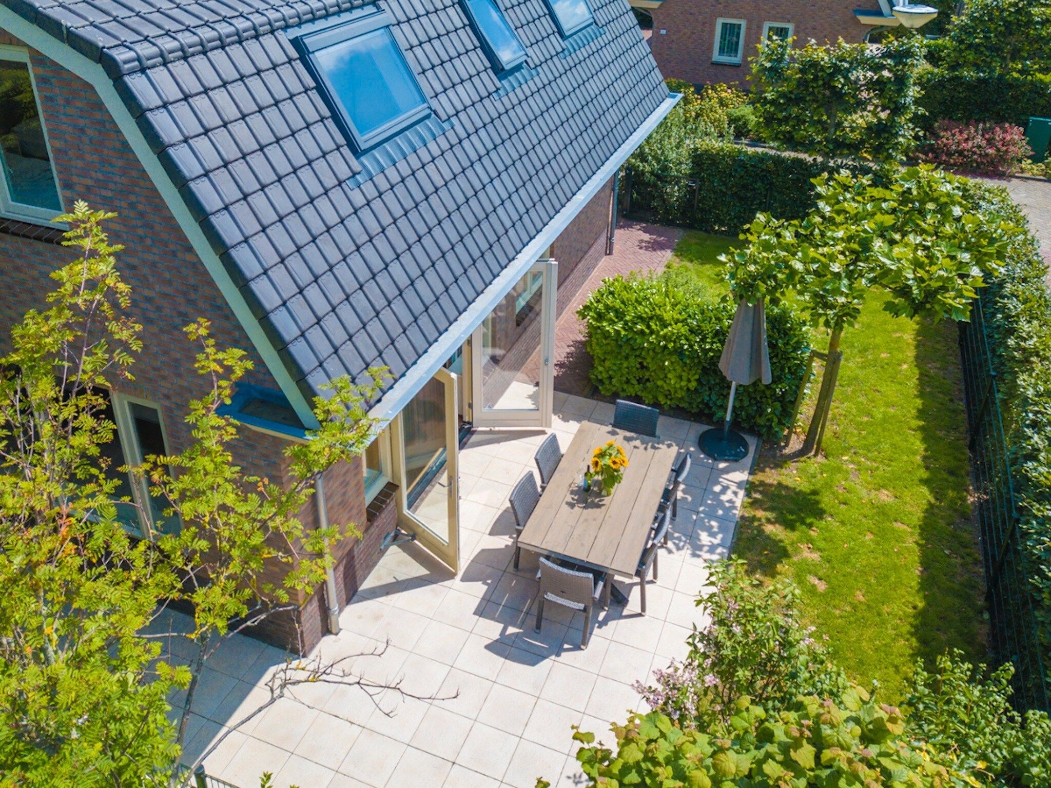 De tuin van Vakantiepark Duinrust 2 in Noordwijk aan zee