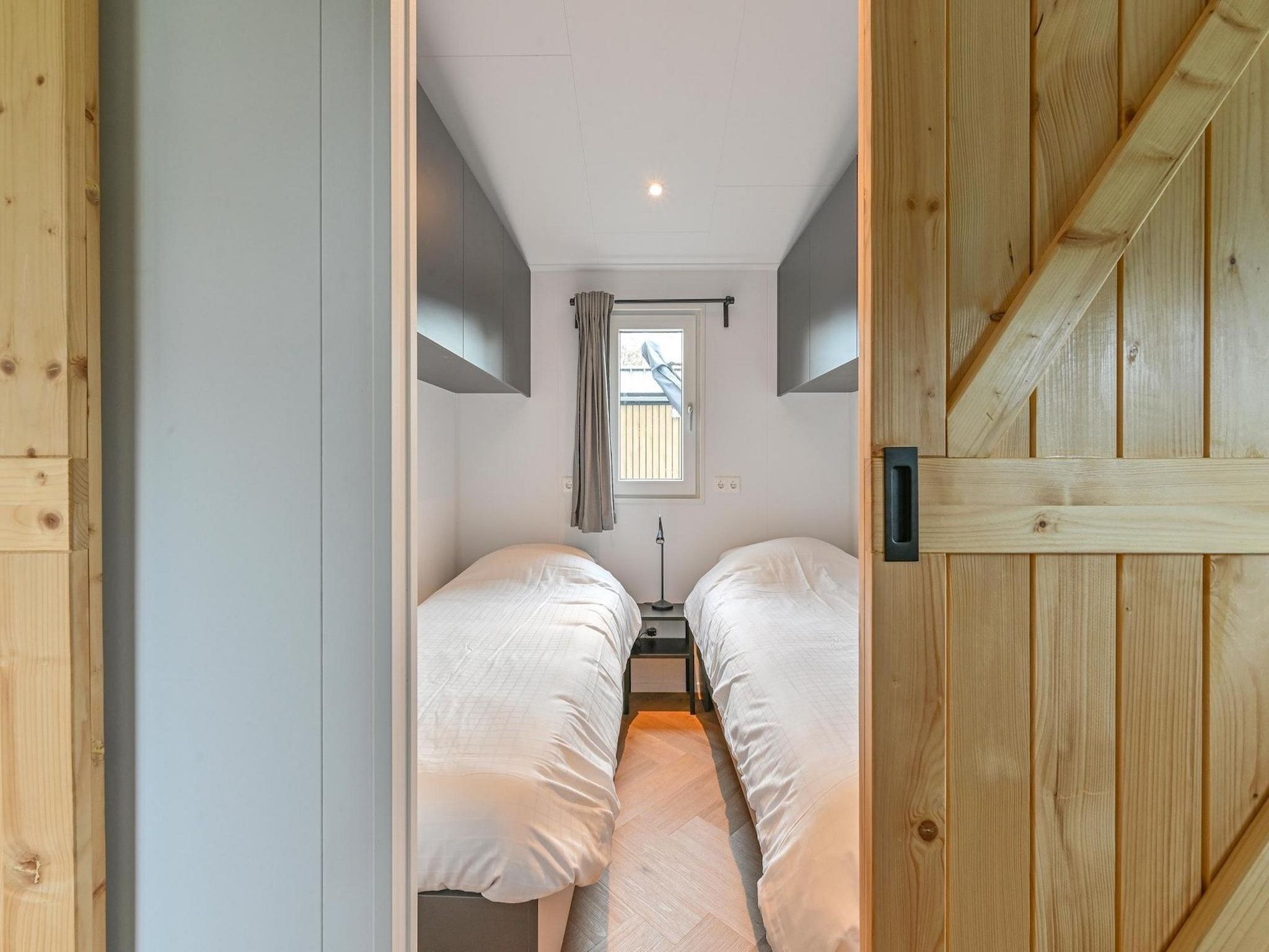 Een slaapkamer van Resort Drentse Weelde 1 in Hoogersmilde