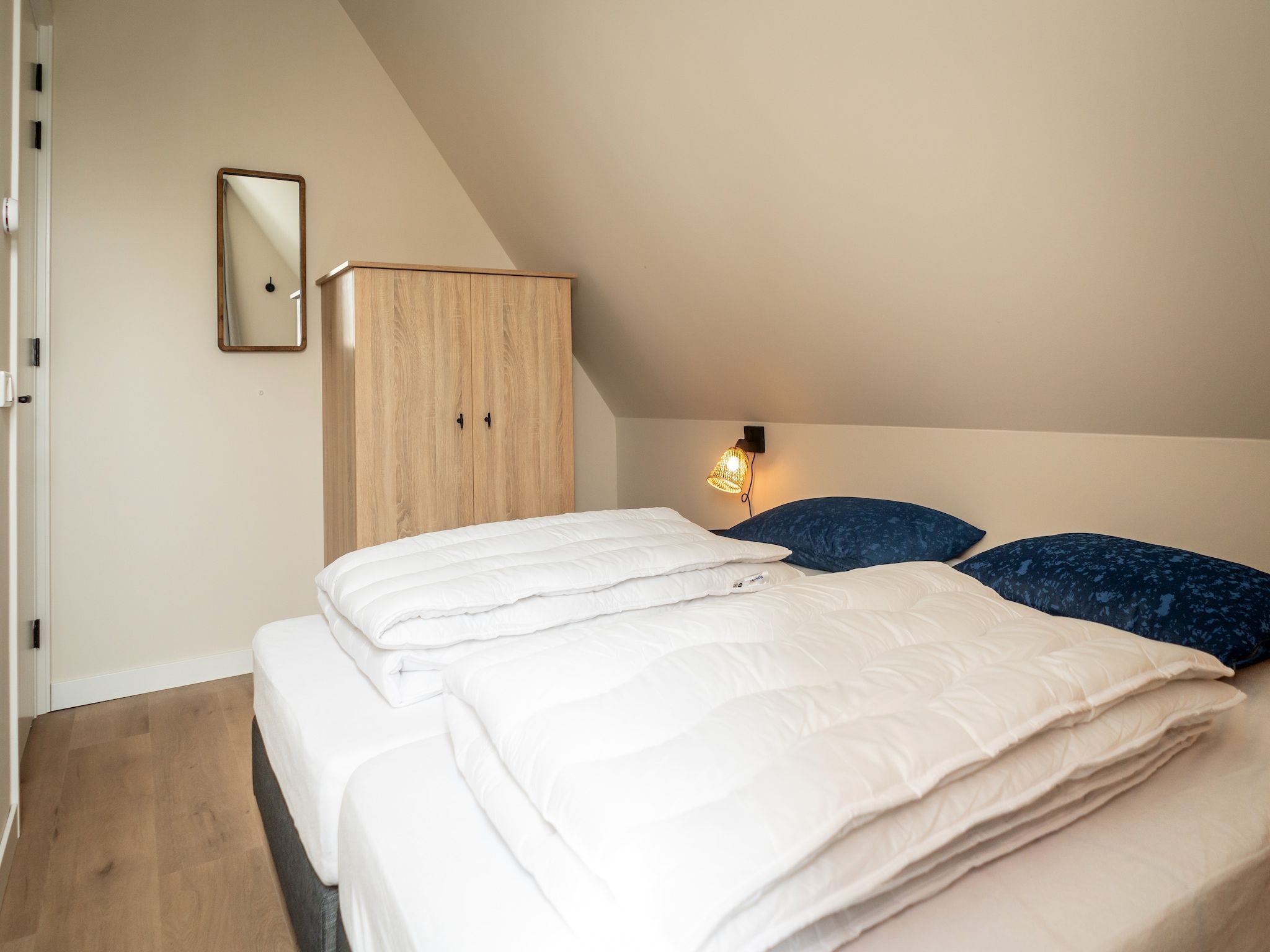 Een slaapkamer van So What 33A in De Koog
