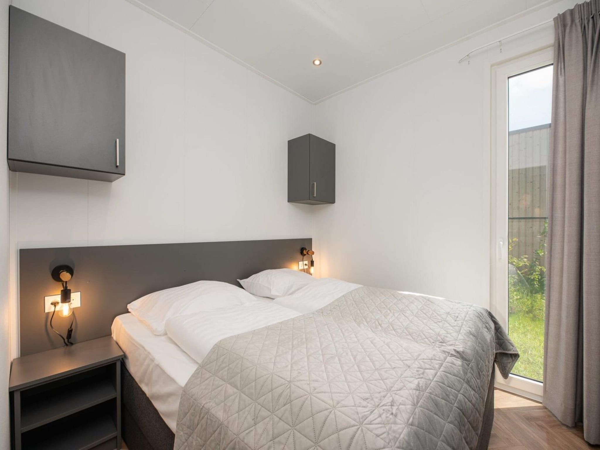 Een slaapkamer van Vakantiepark Mölke 36 in Zuna