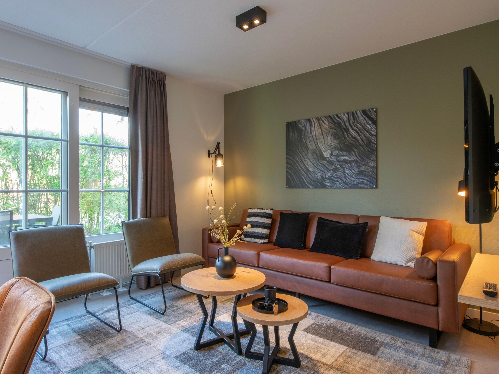 De woonkamer van Vakantiepark de Katjeskelder 25 in Oosterhout