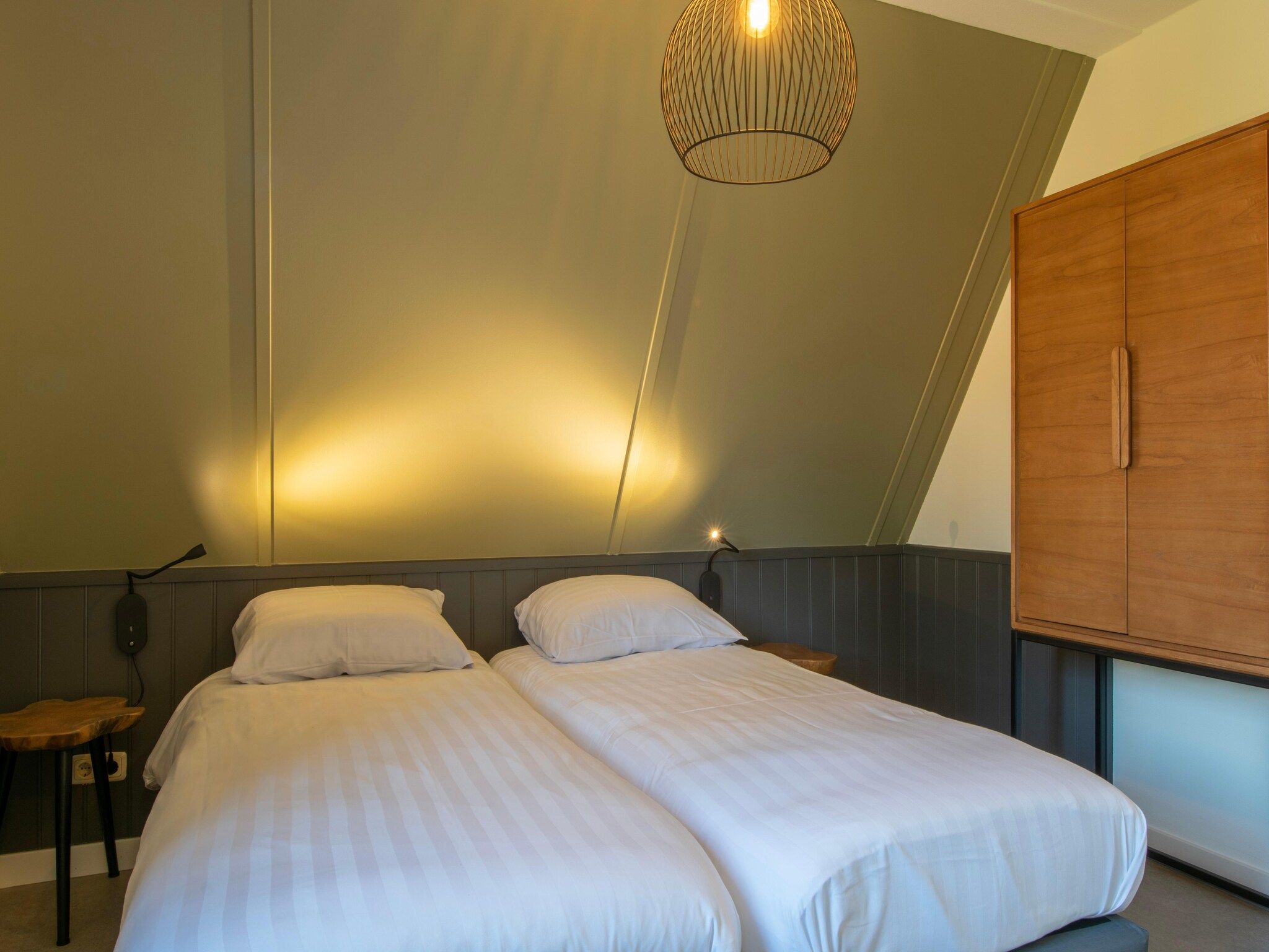 Een slaapkamer van Vakantiepark de Katjeskelder 25 in Oosterhout