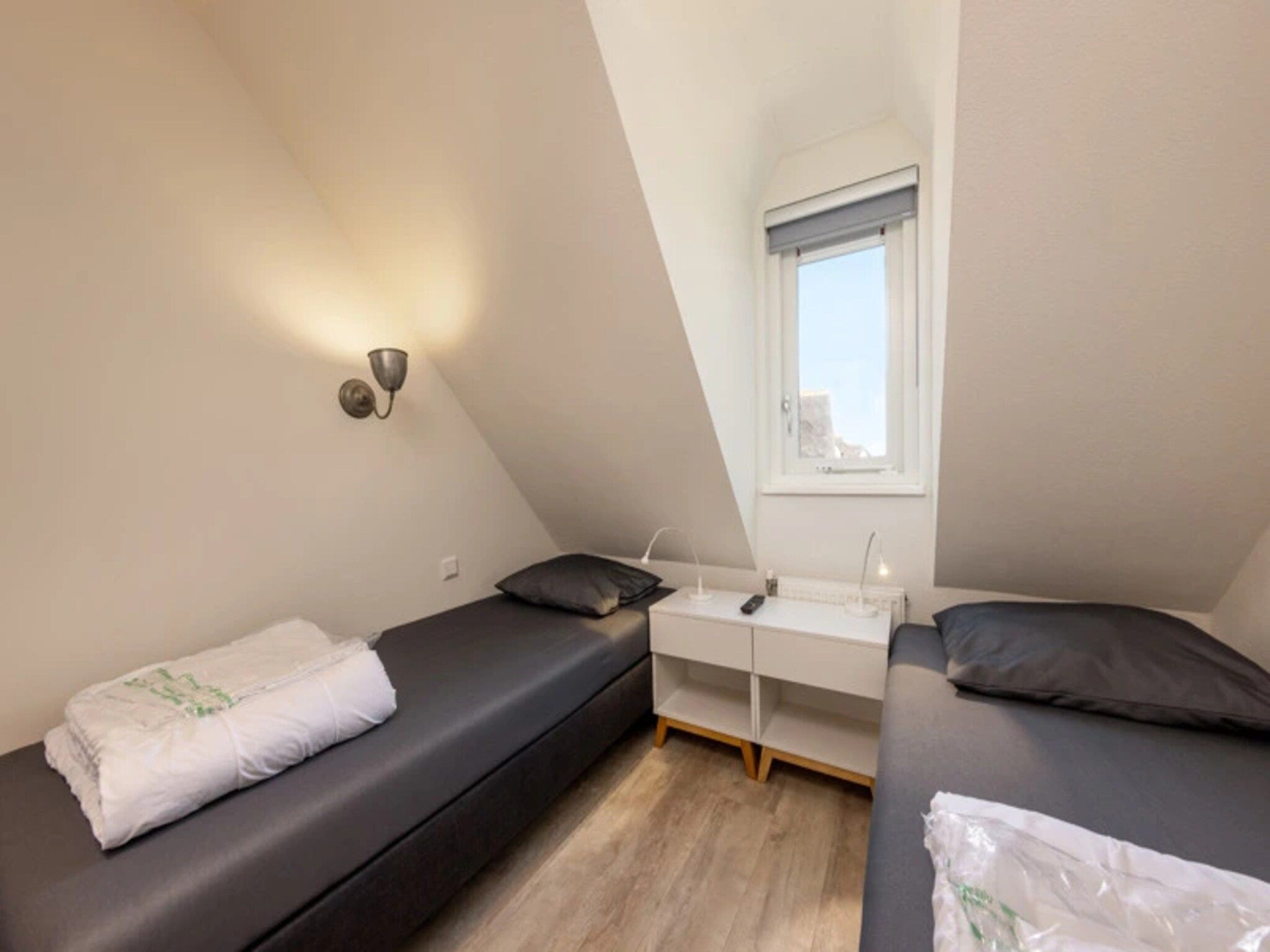 Een slaapkamer van Vakantiepark Duynzicht 2 in Julianadorp aan zee