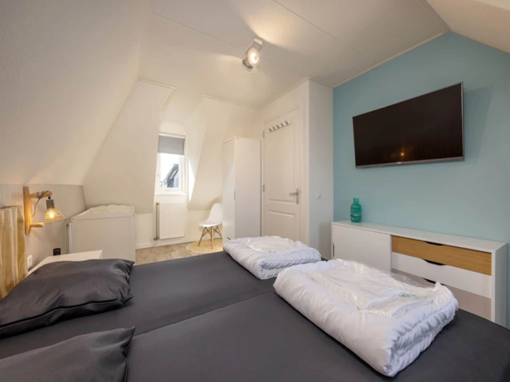 Een slaapkamer van Vakantiepark Duynzicht 2 in Julianadorp aan zee